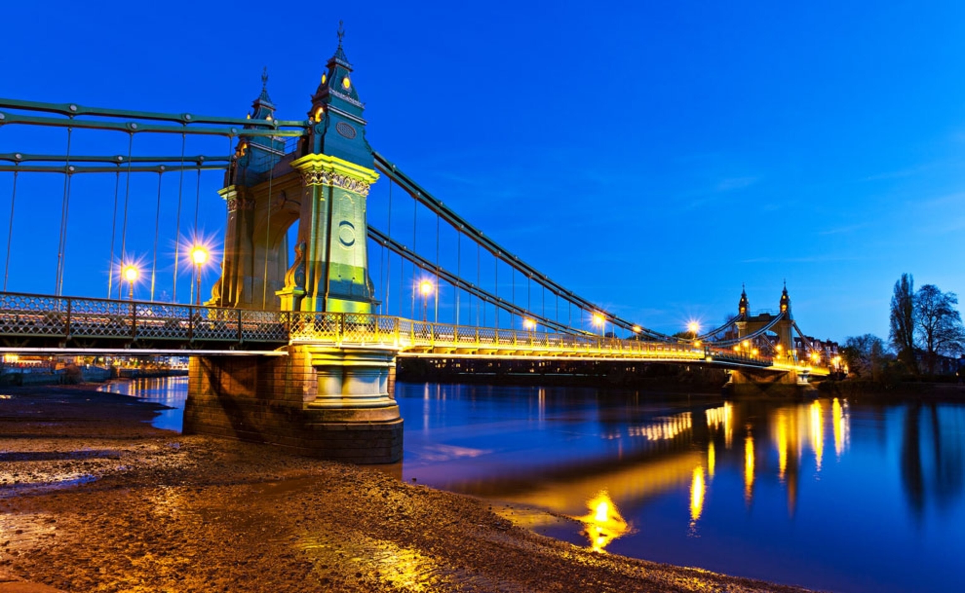Hammersmith Bridge stretching over the Thames, London
