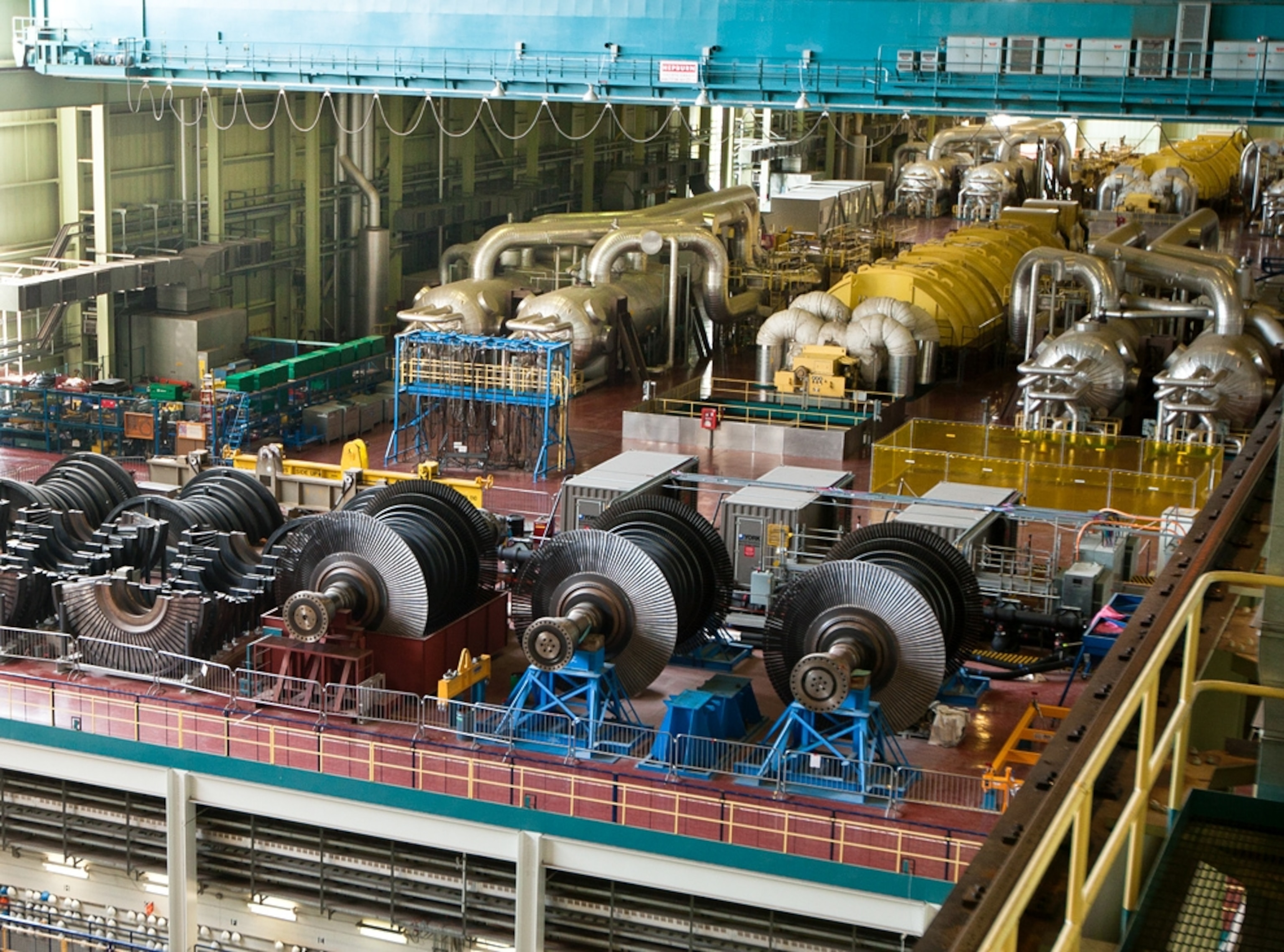 Big silver pipes in the turbine hall of a power station in Ontario, Canada