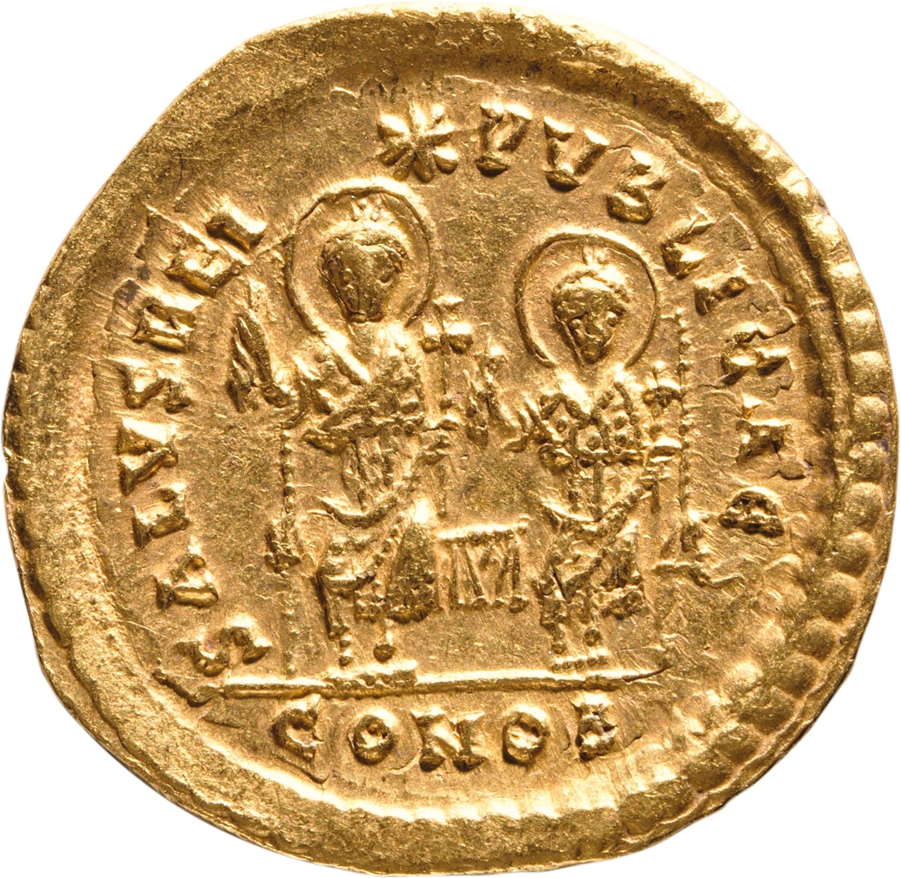 A golden coin with two men on the face
