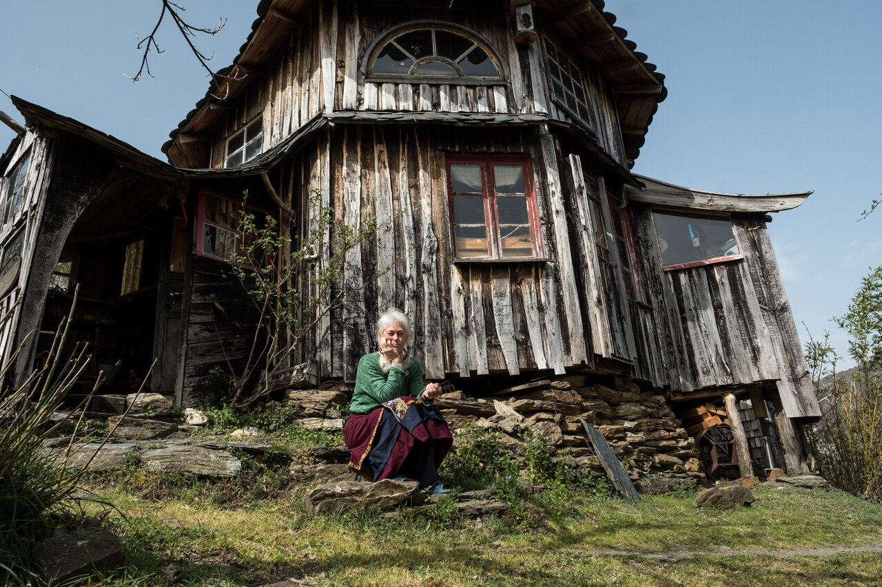 Portrait of a woman on a front porch step