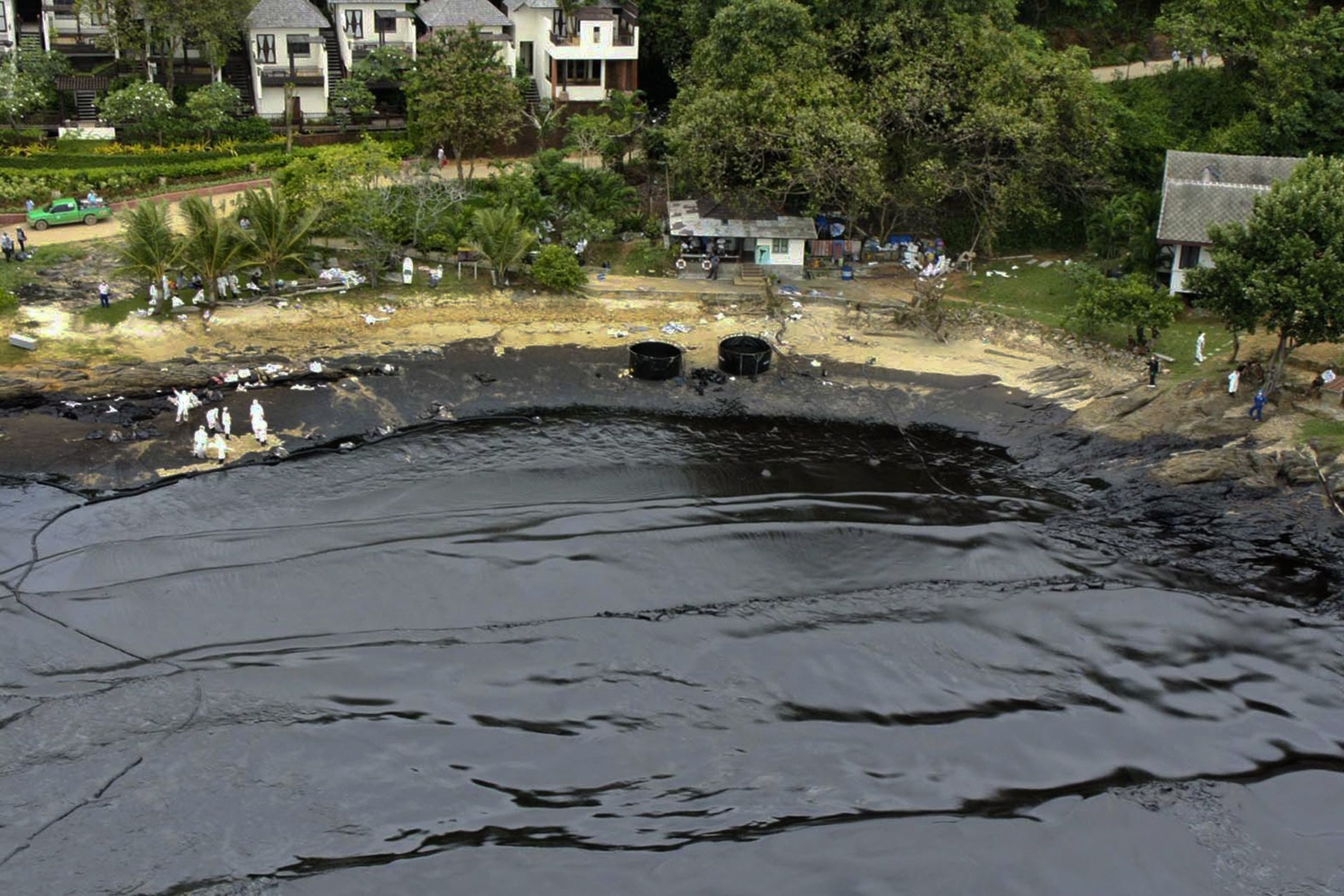 Aerial view of a Thai beach covered in oil