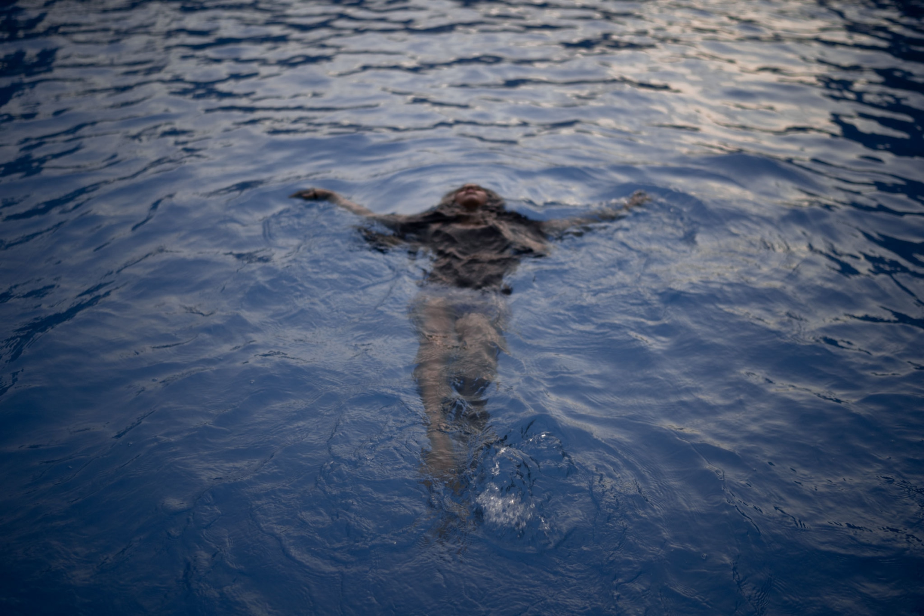 a woman swims in a pool