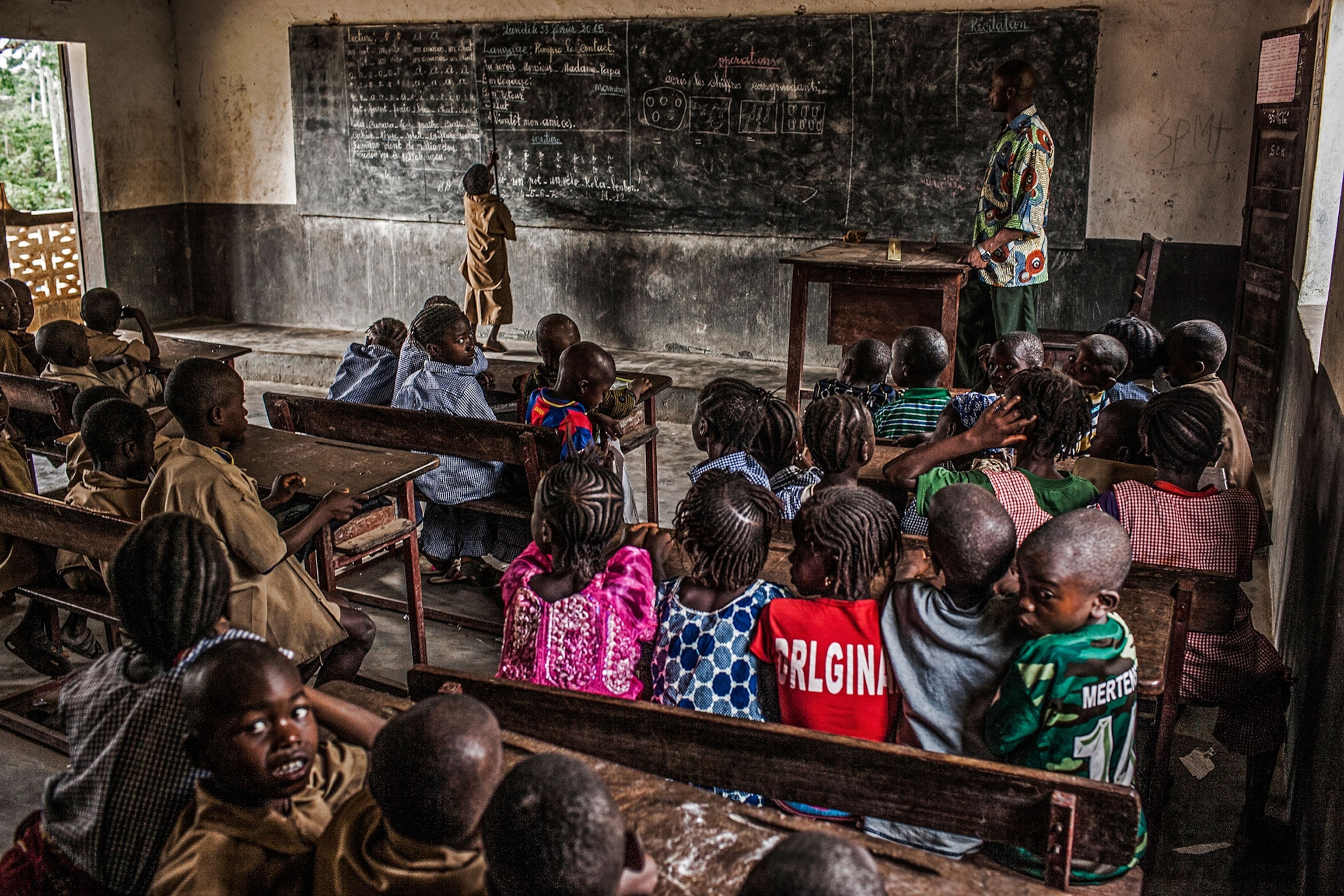 a students in a classroom in remote Guinea