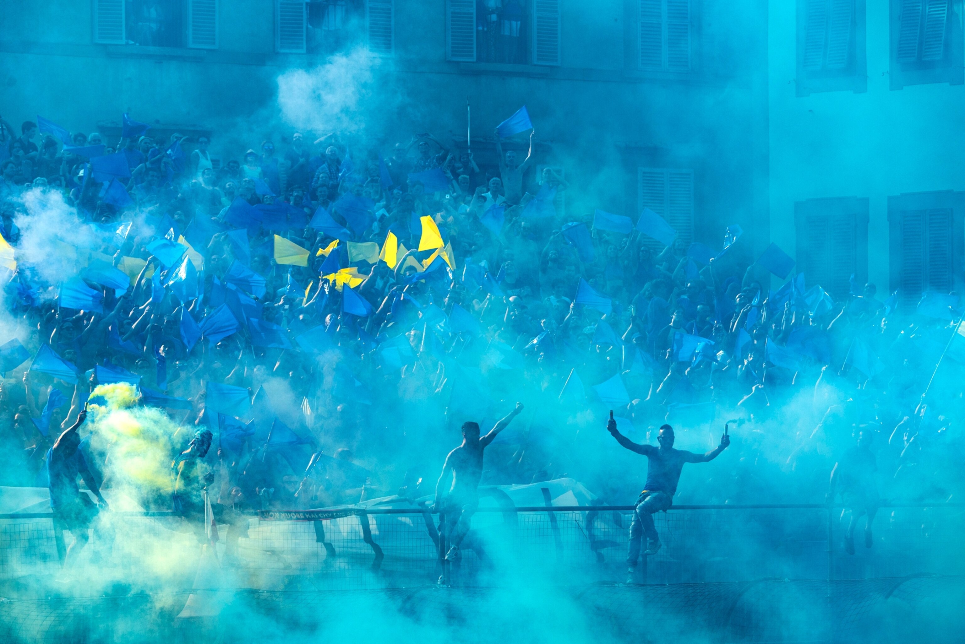 fans of the Azzurri (blues) of Santa Croce cheer on their team