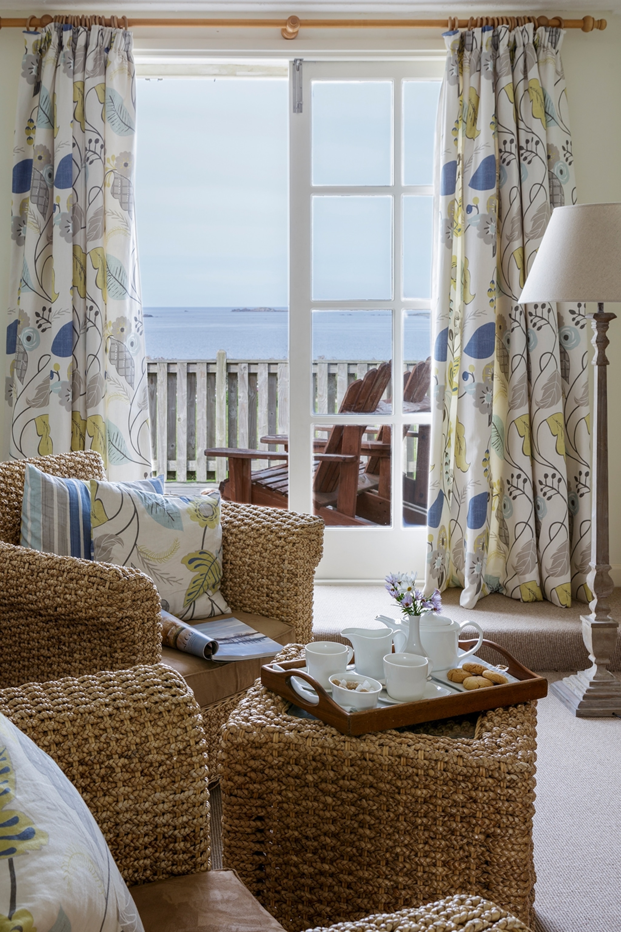 A living room overlooks the sea.