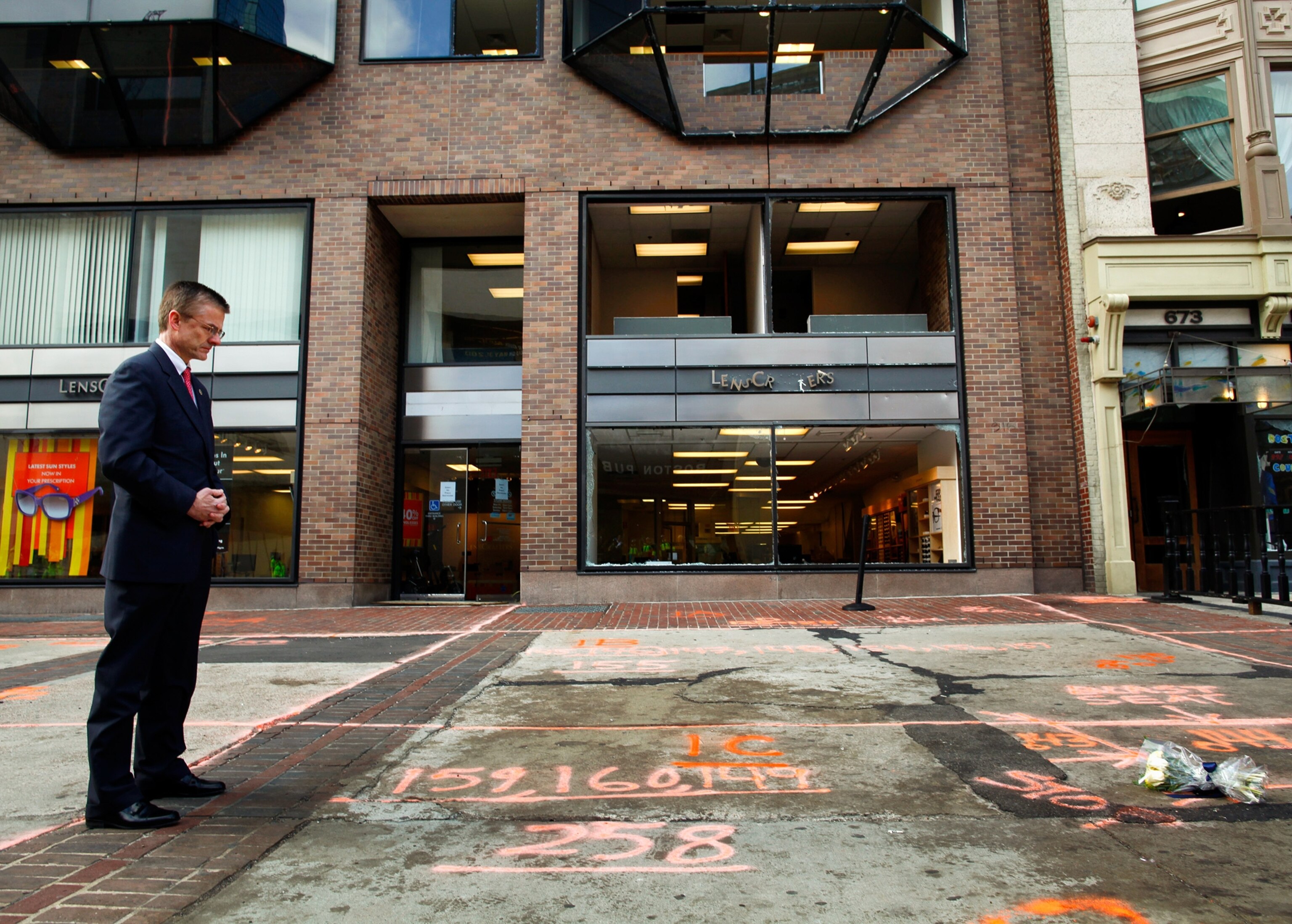 An FBI agent looks at the scene of a bombing in Boston.
