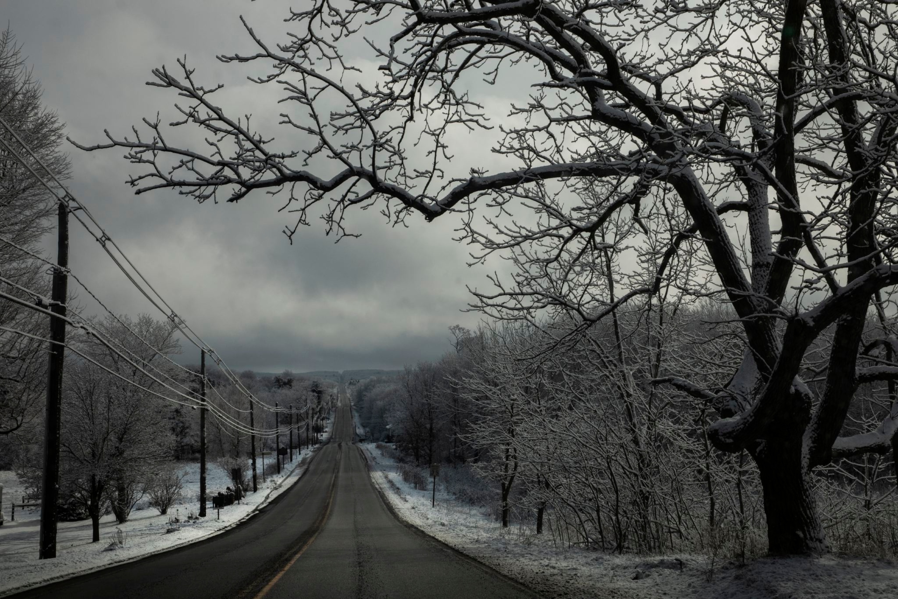 A highway flanked by snowy land
