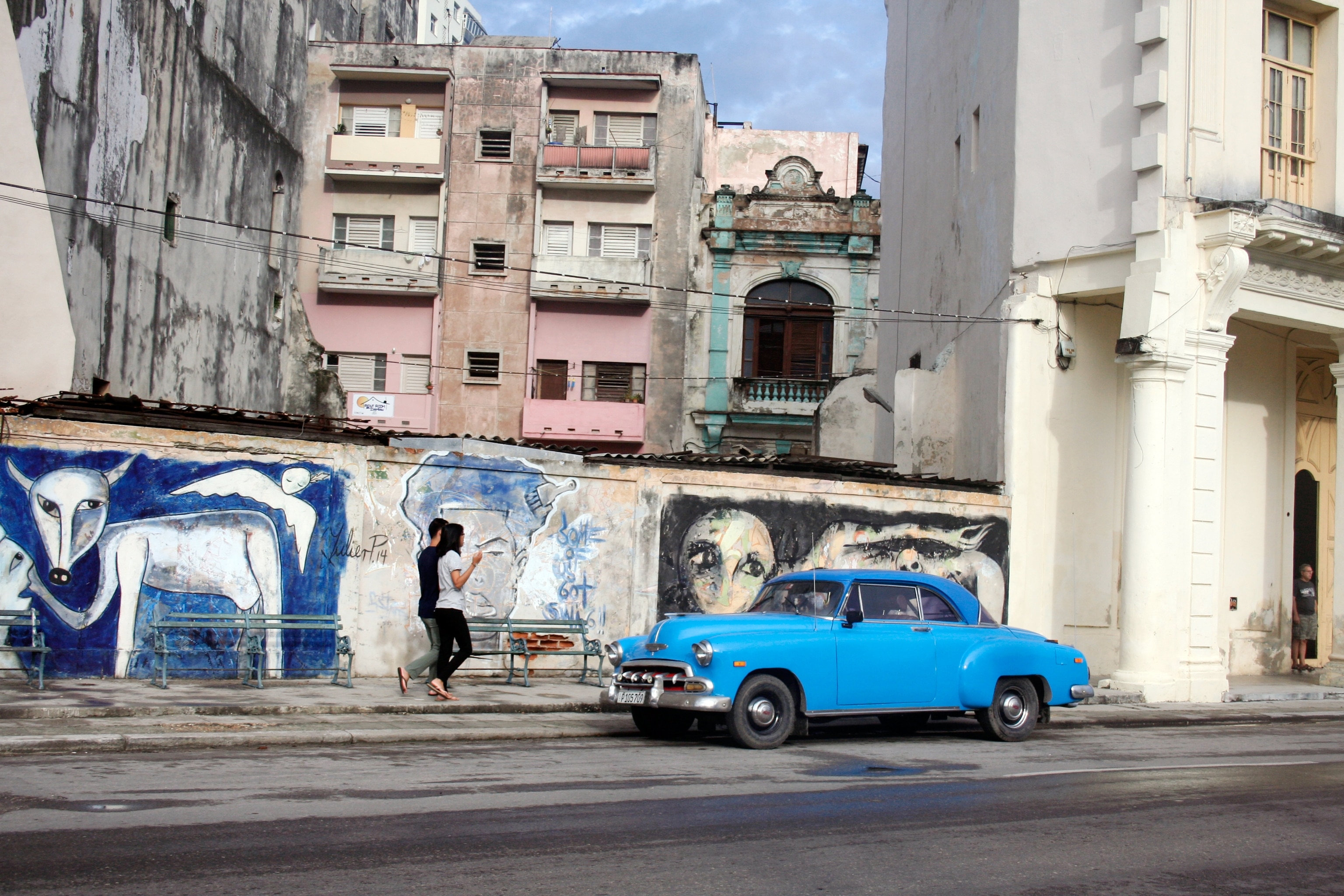 a couple walking along the street, Havana, Cuba