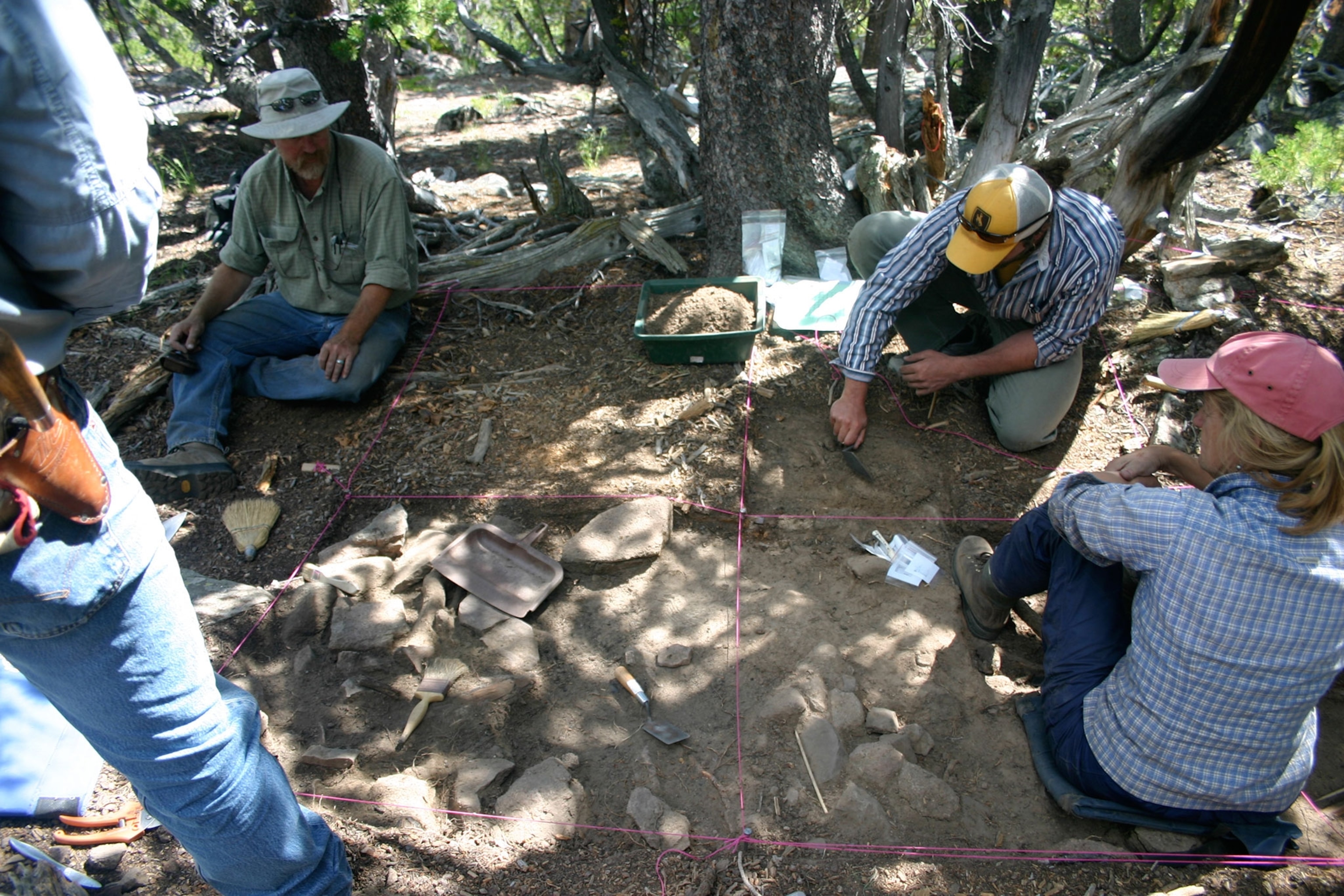 Dr. Richard Adams and team excavating a 600 year old house structure at High Rise Village