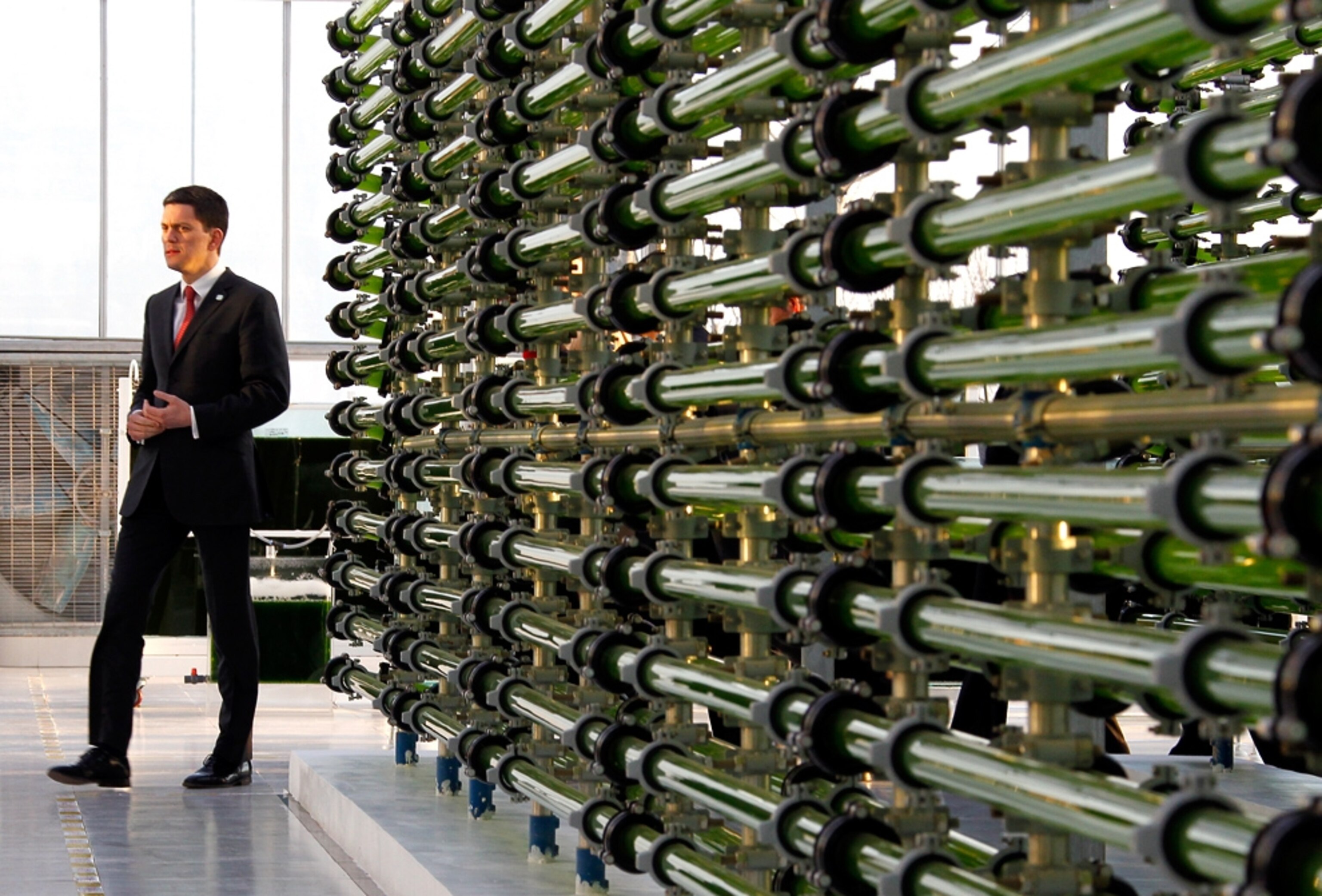 British Foreign Secretary David Miliband walks through an algae research center in China.