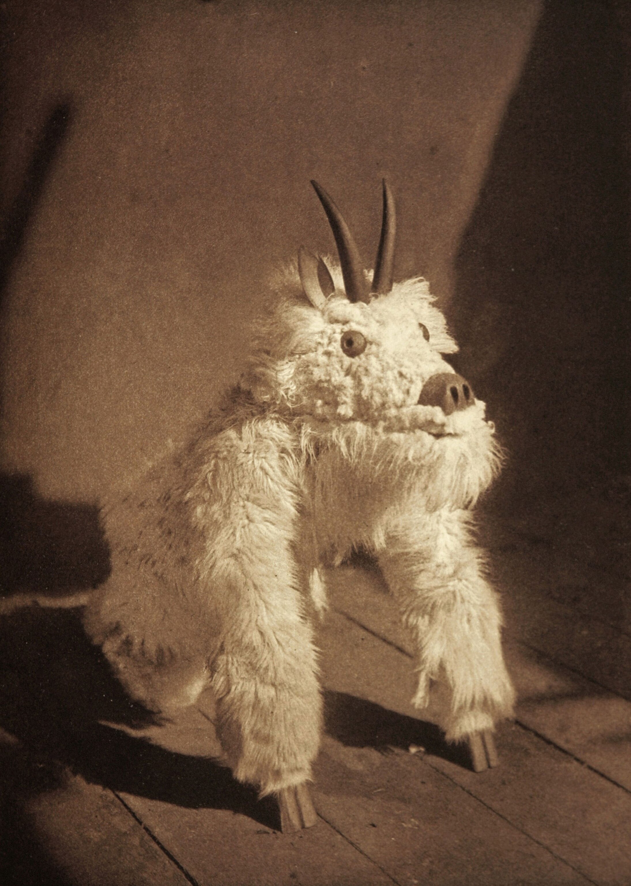 Native American man in ceremonial clothing.
