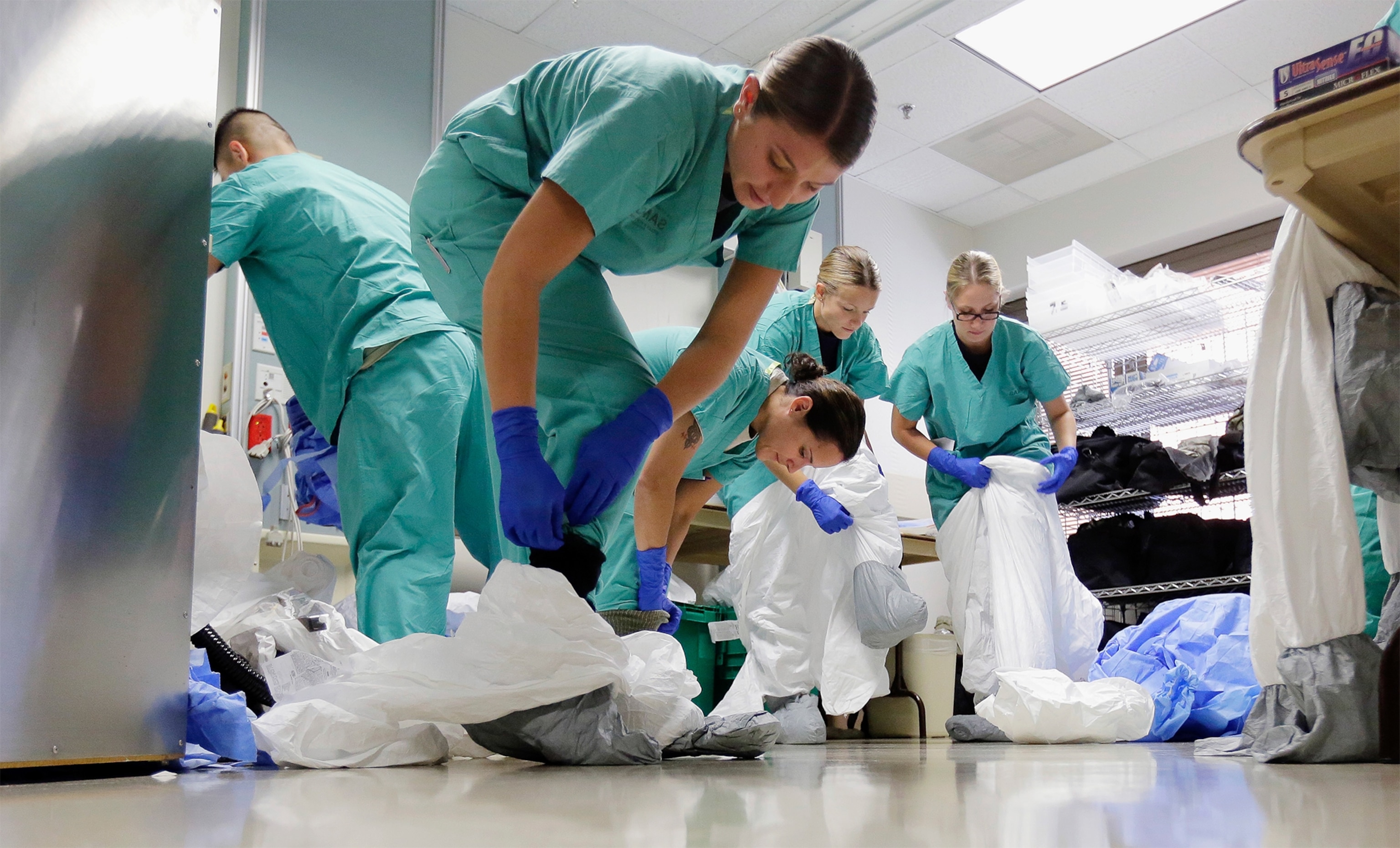 healthcare workers wearing protective gear during an Ebola training.