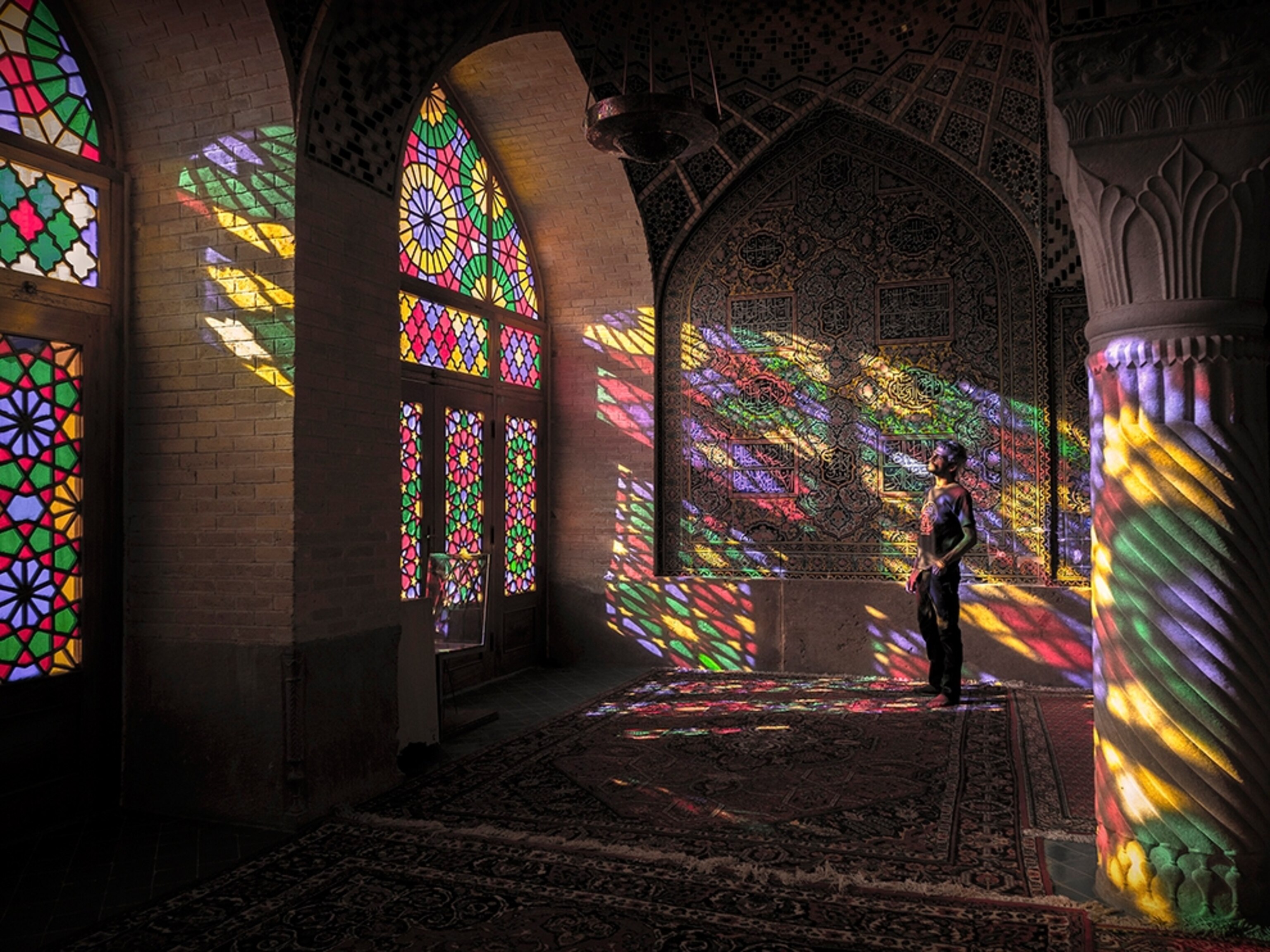 a man standing in a mosque in Shiraz, Iran