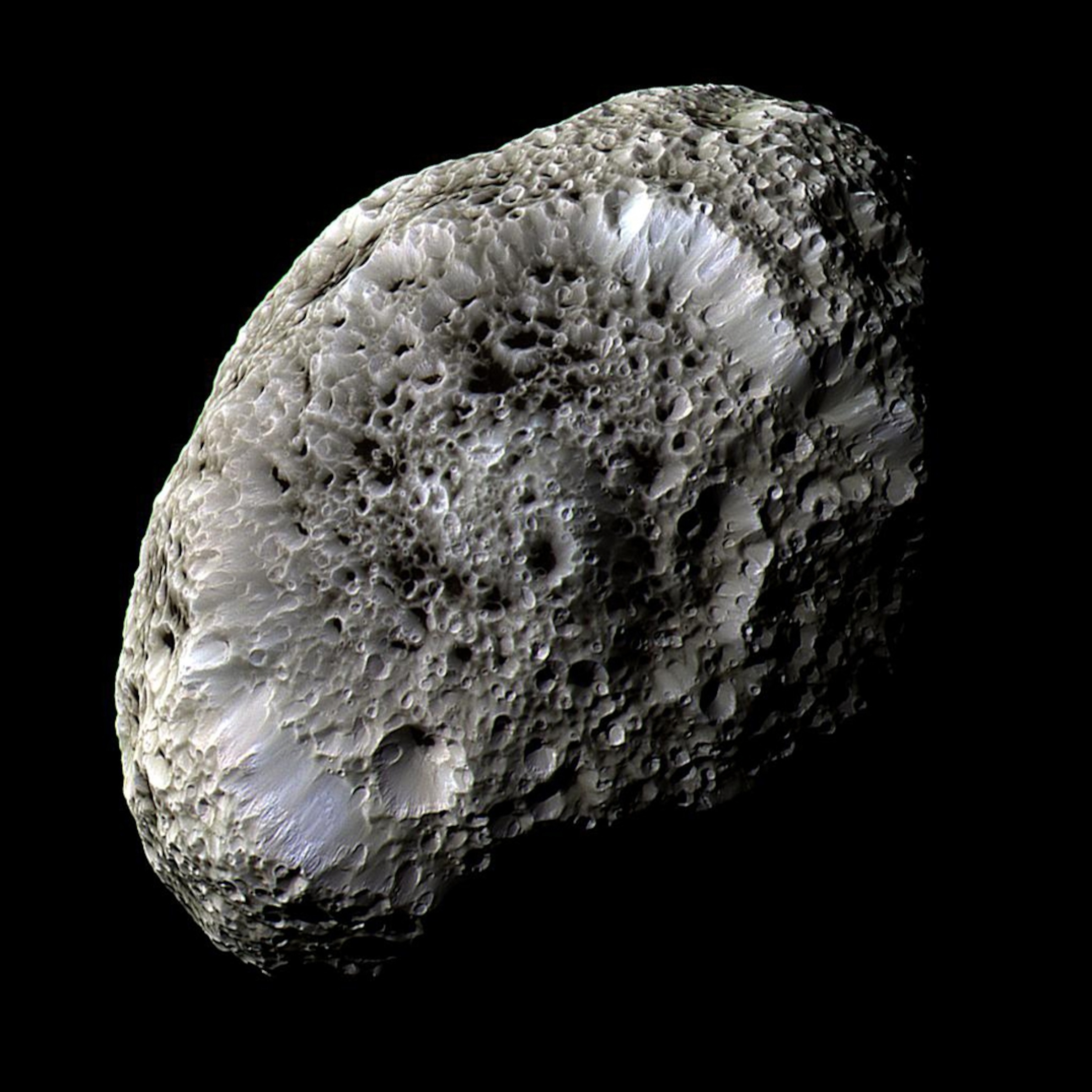 Shot in 2005, this false-color image of Hyperion revealed a world unlike anything else in the solar system. (NASA/JPL/SSI)