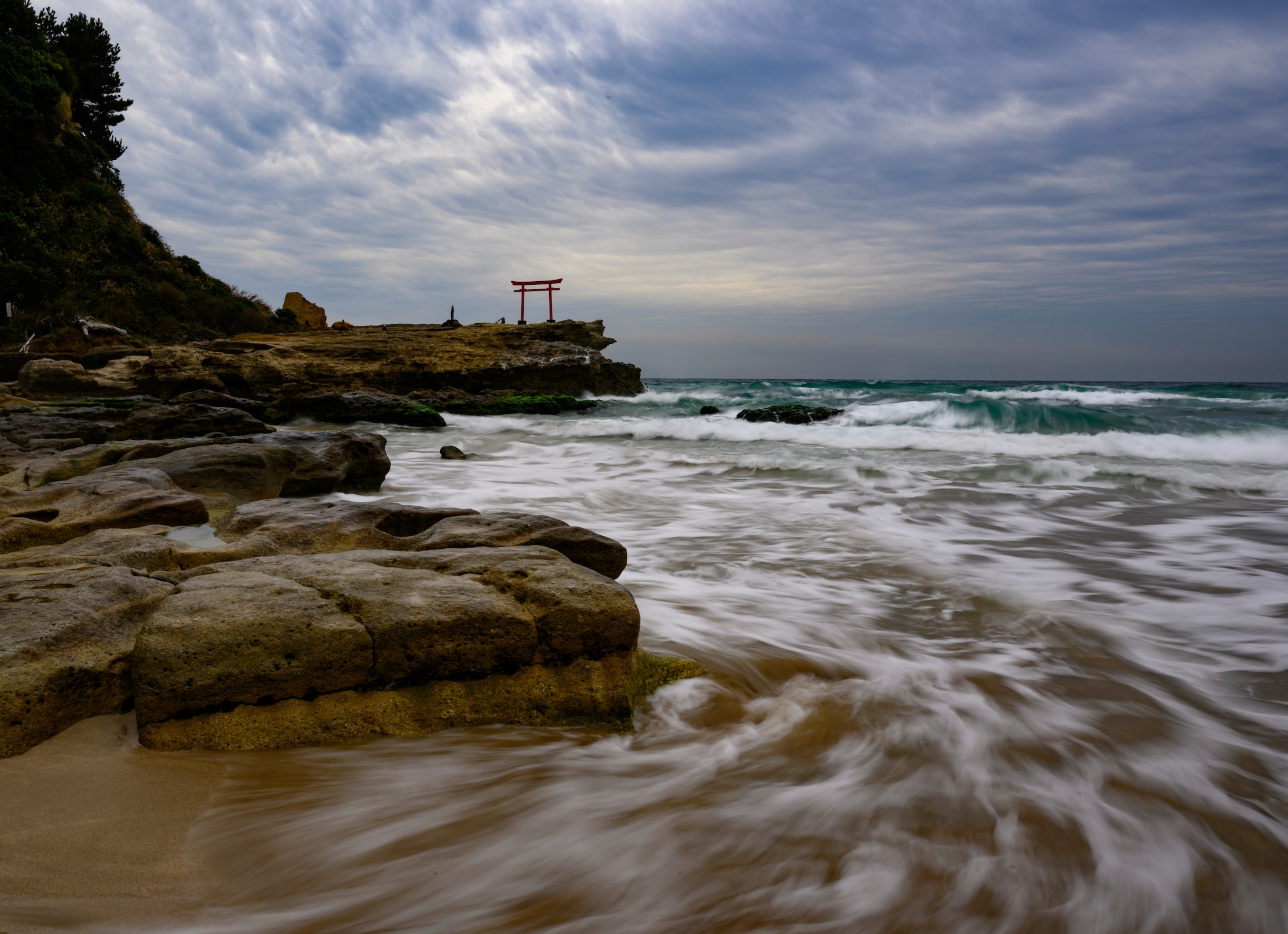 A sacred torii gate on Shirahama Beach on the Izu Peninsula.
