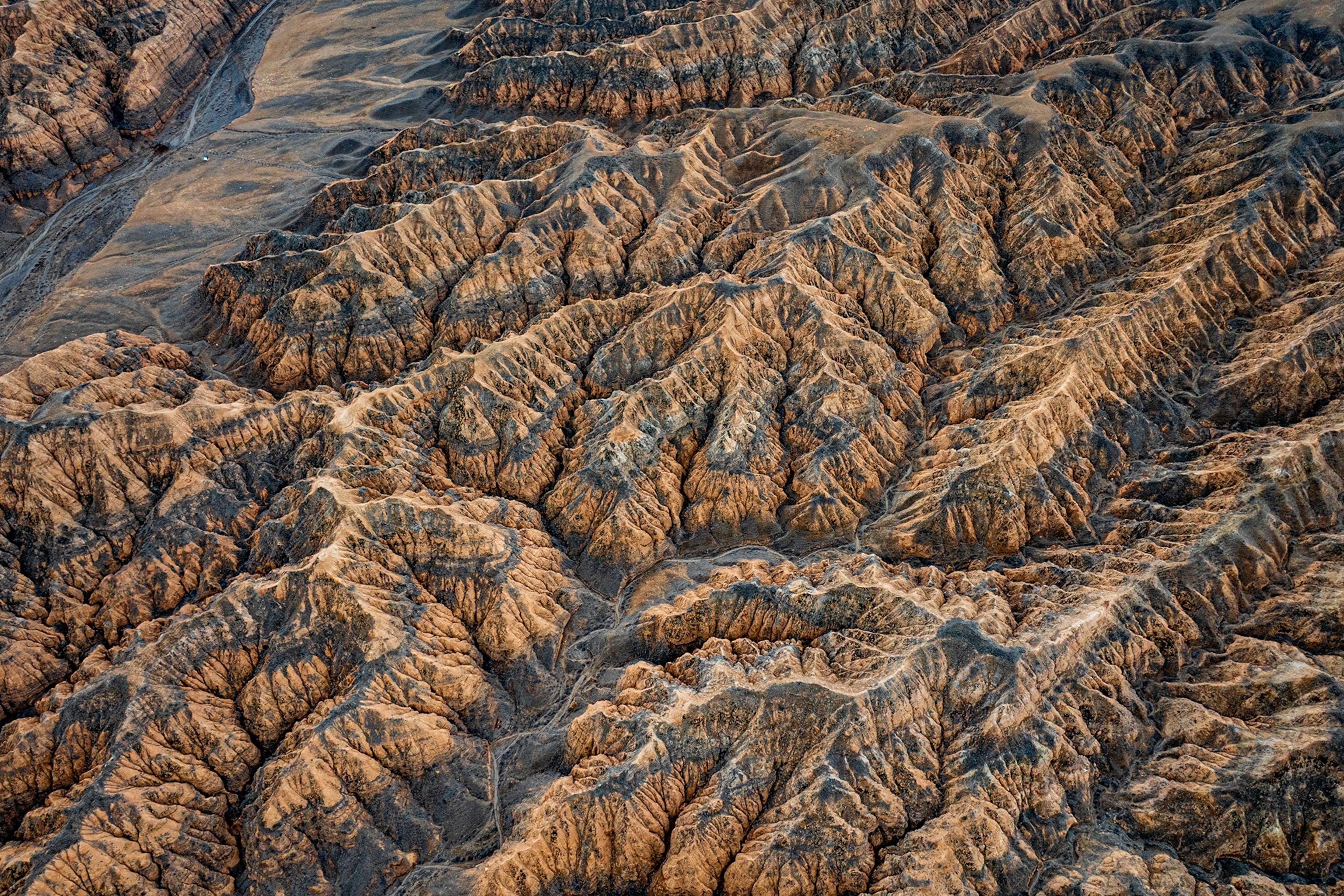 An aerial shot of a rocky mountain range.