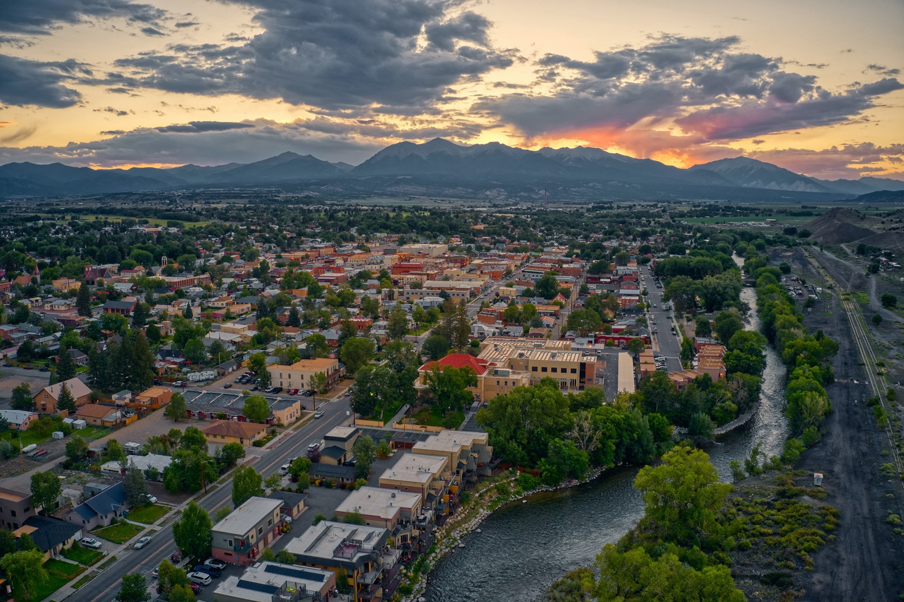 Aerial of riverfront town at sunset