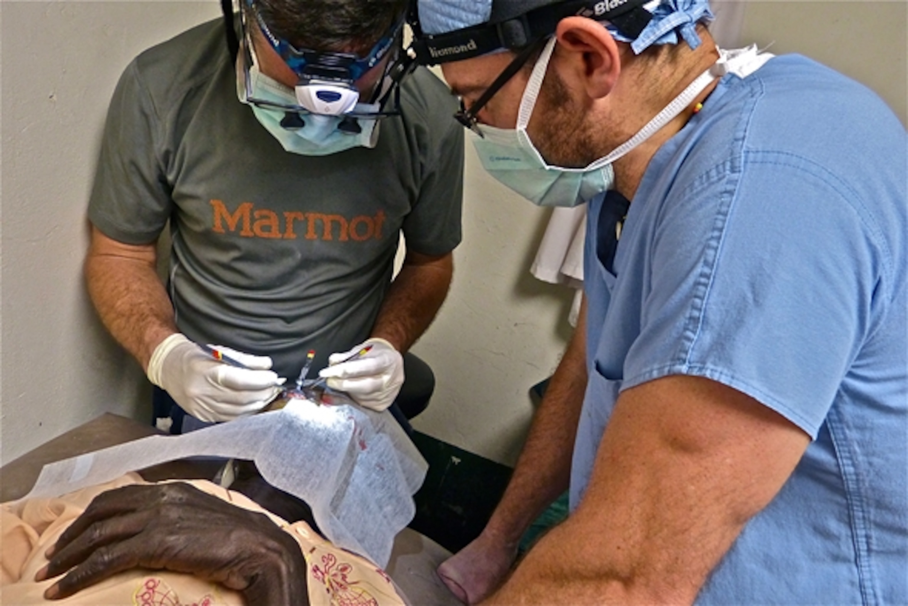 Dr. Tabin and Dr. Williams tag late night Trachoma surgeries; Photograph by Jordan Campbell