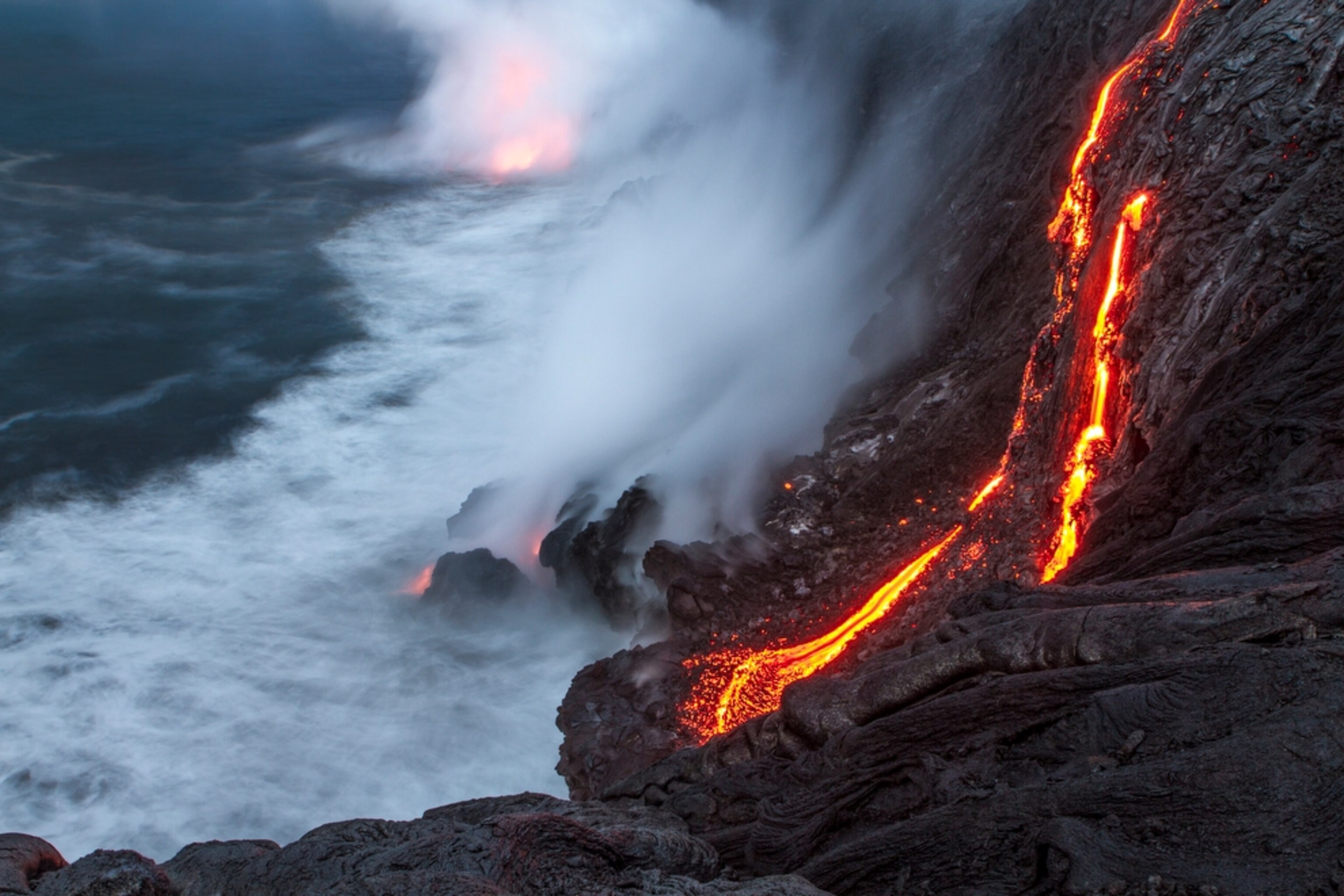 lava flowing into the Pacific Ocean in Kalapana, Hawaii
