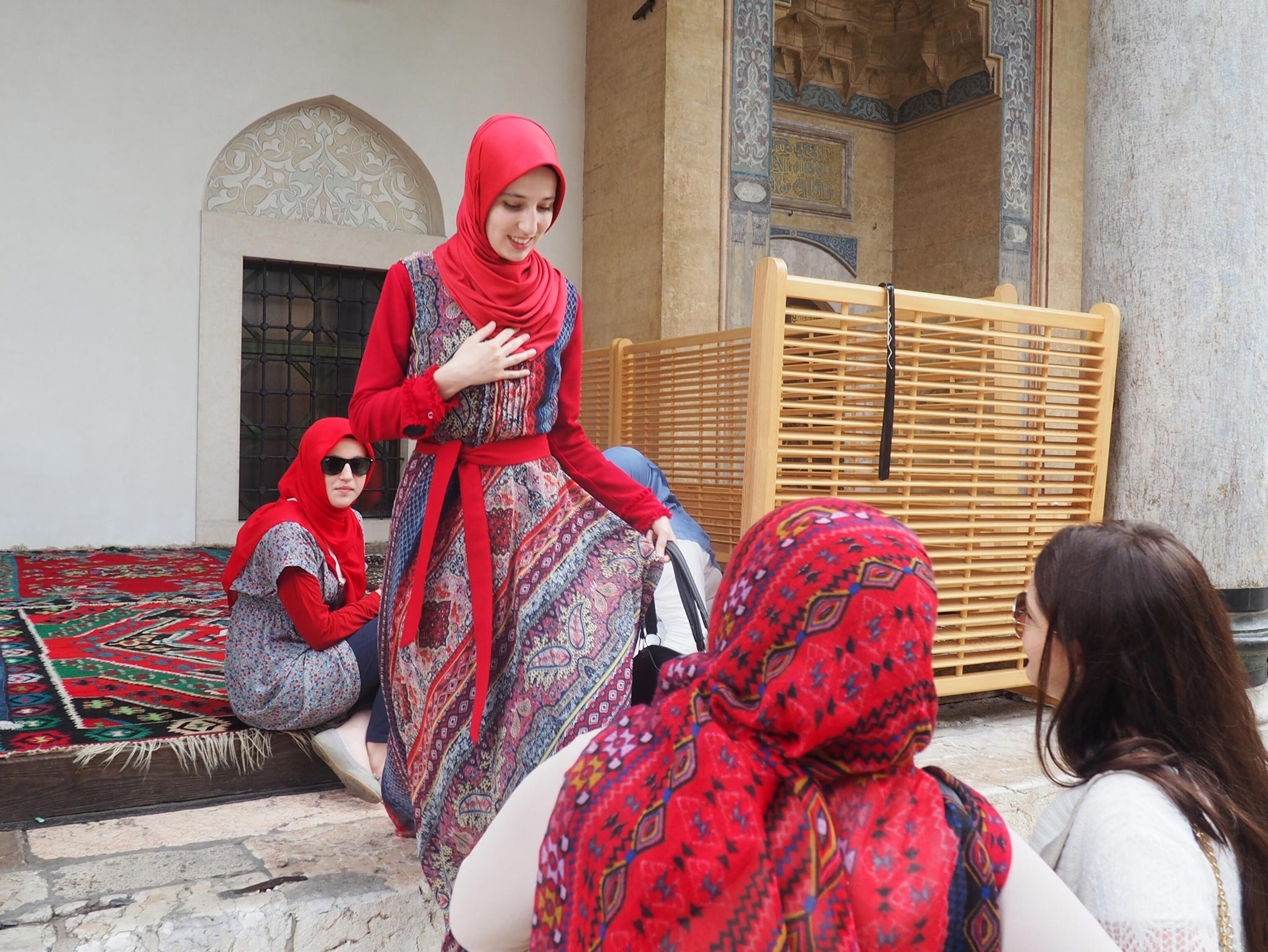 Young Muslim women in front of the  Emperor's Mosque in Sarajevo