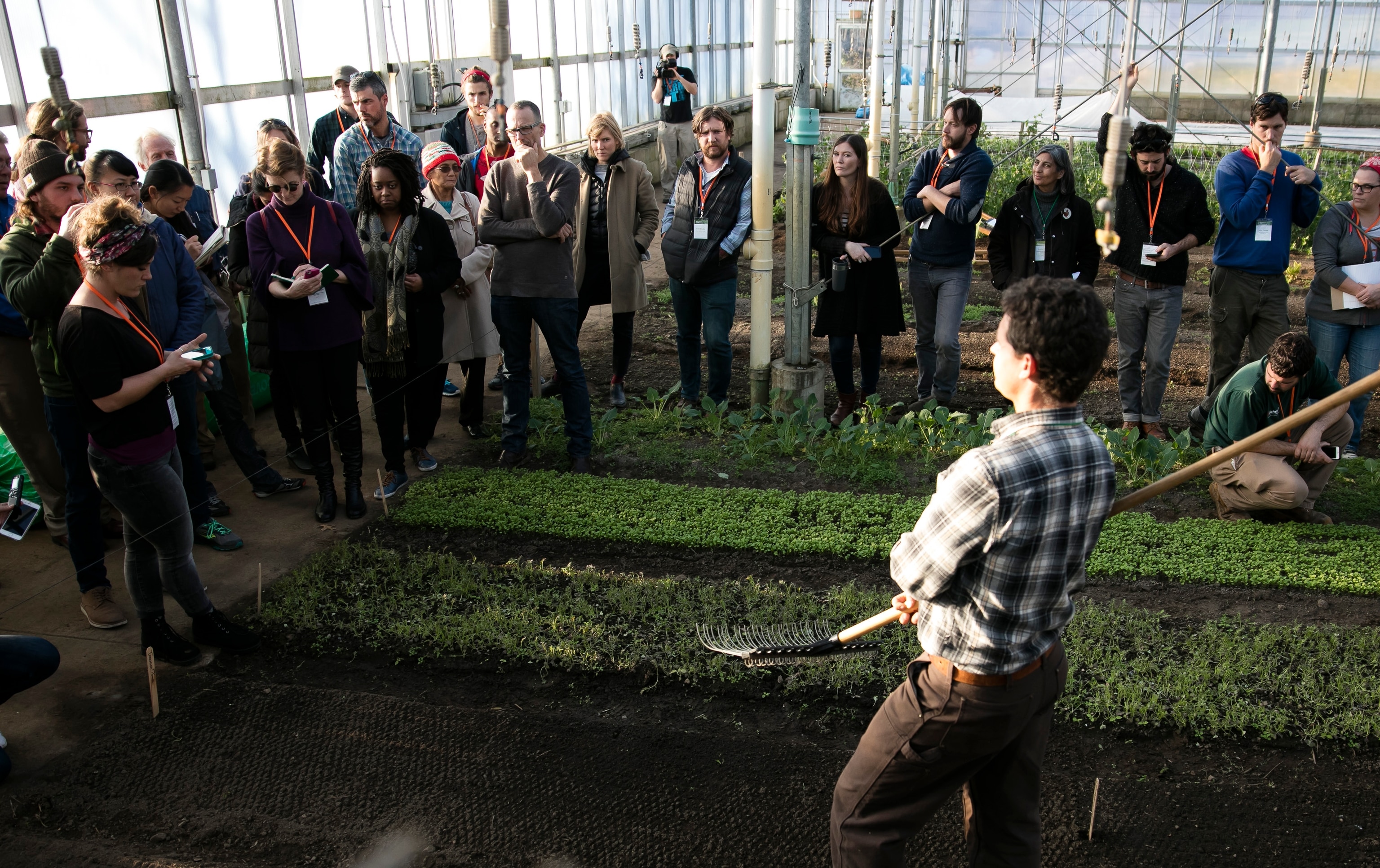 Attendees at the Stone Barns Young Farmers Conference listen to a lecture on greenhouse growing. Photograph by Ben Hider