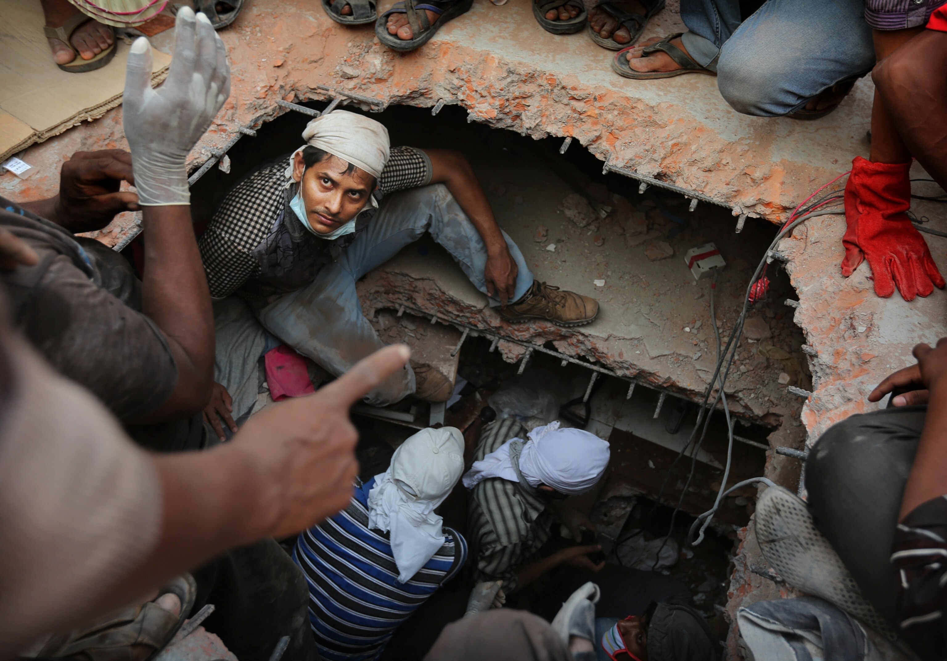 rescuers at the site of a garment factory building collapse near Dhaka, Bangladesh