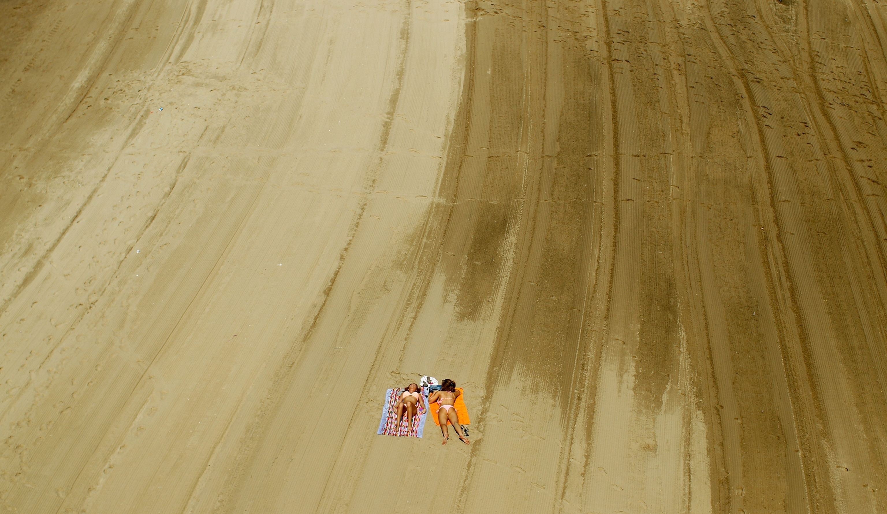 two women sunbathing in Warsaw, Poland