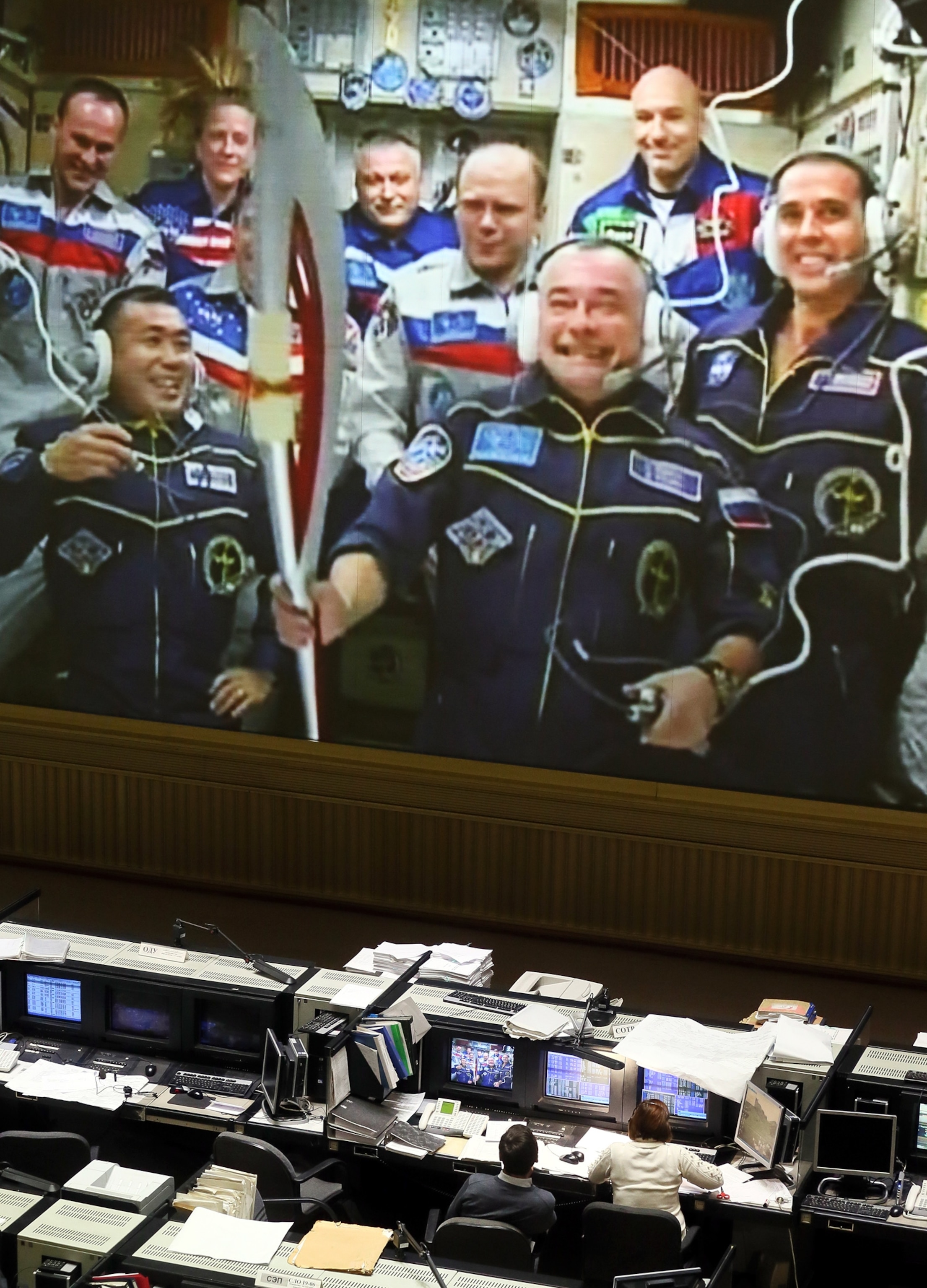 the crew at the International Space Station with the Olympic torch.