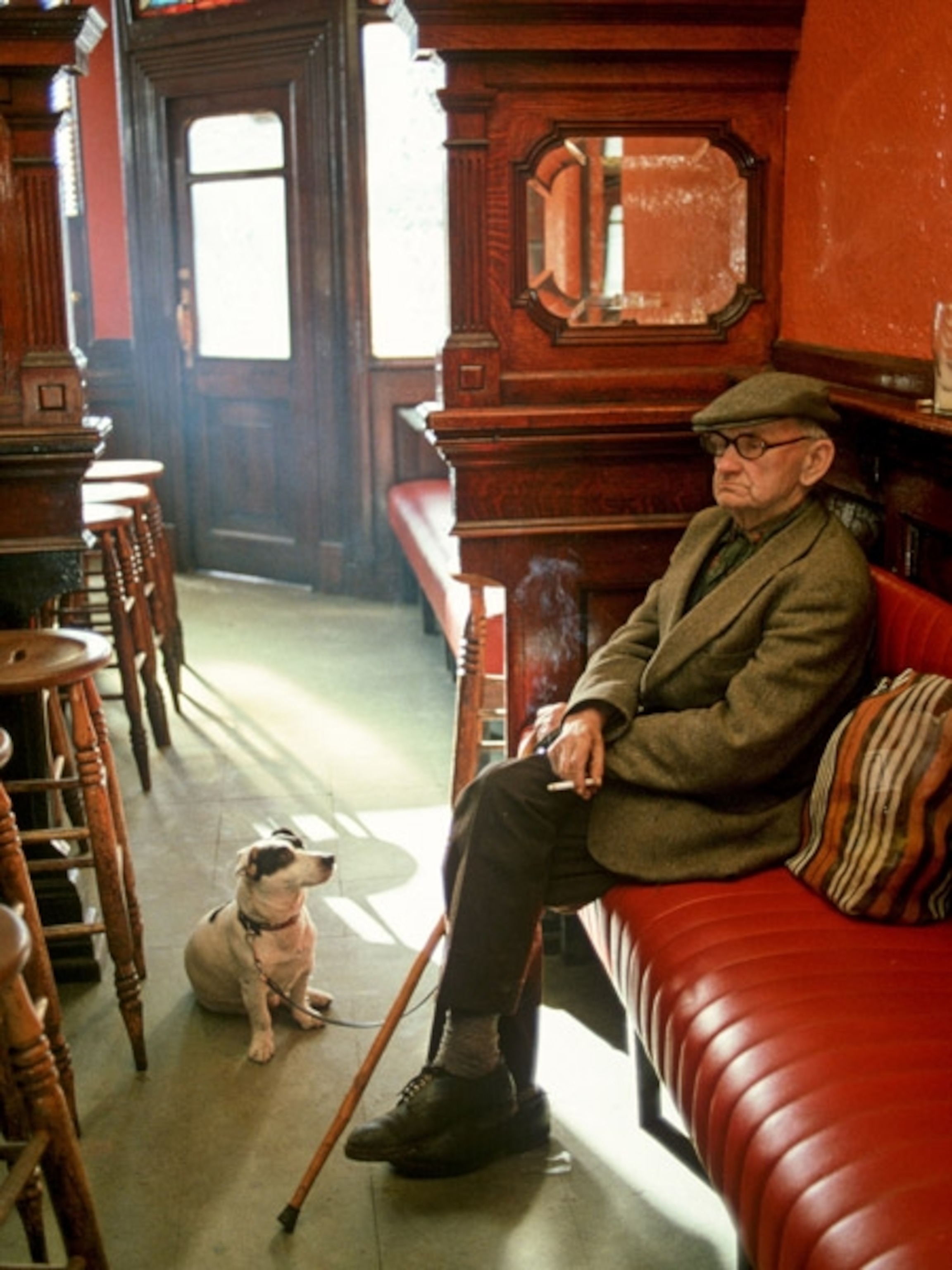 A man in his dog in a pub
