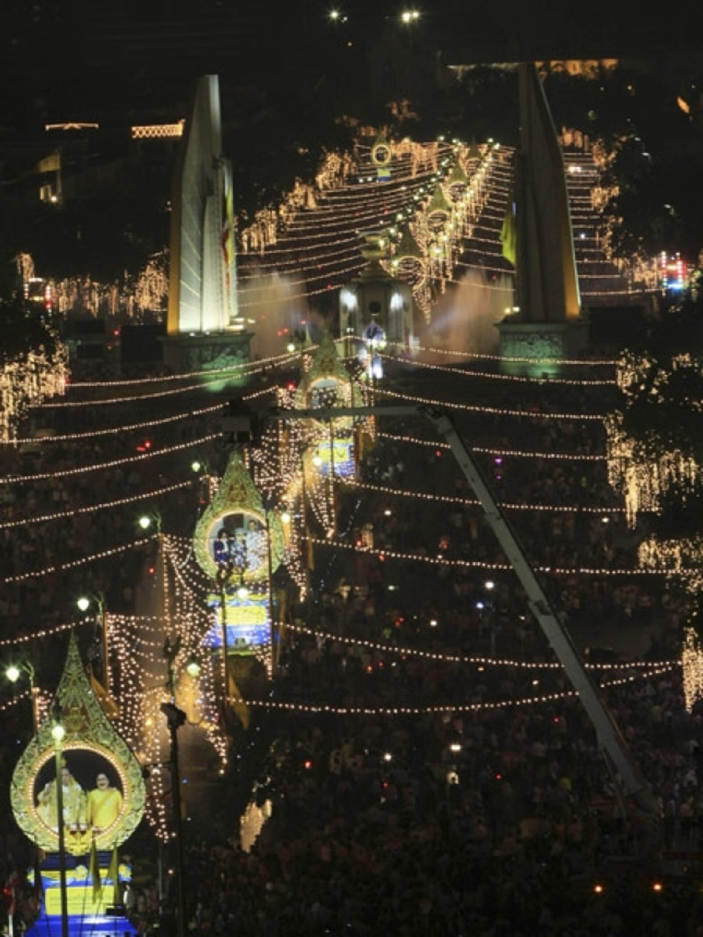 Lights and pictures of the Thai king strung along an avenue