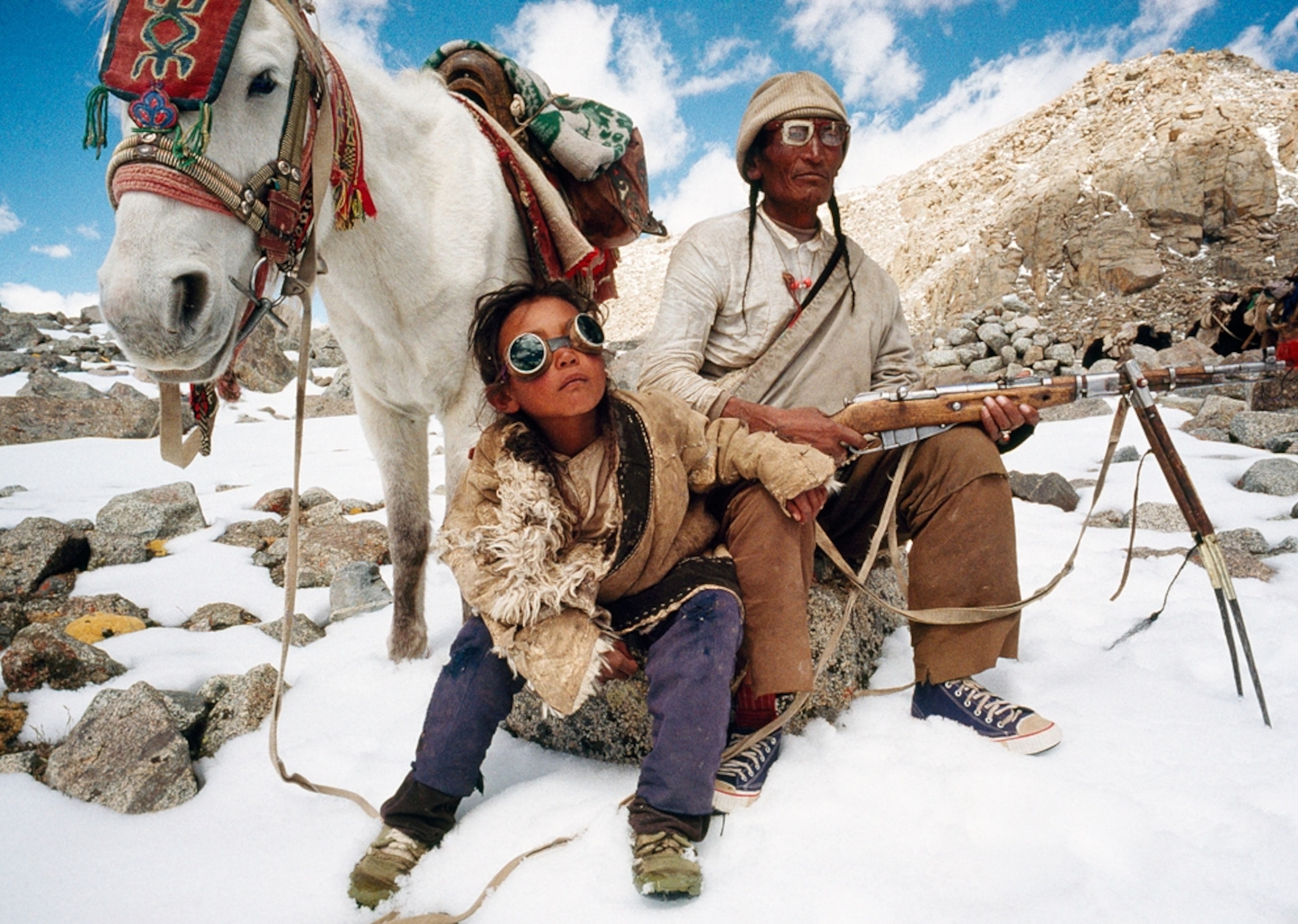 A father and son on a pilgrimage around Mt. Kailas.