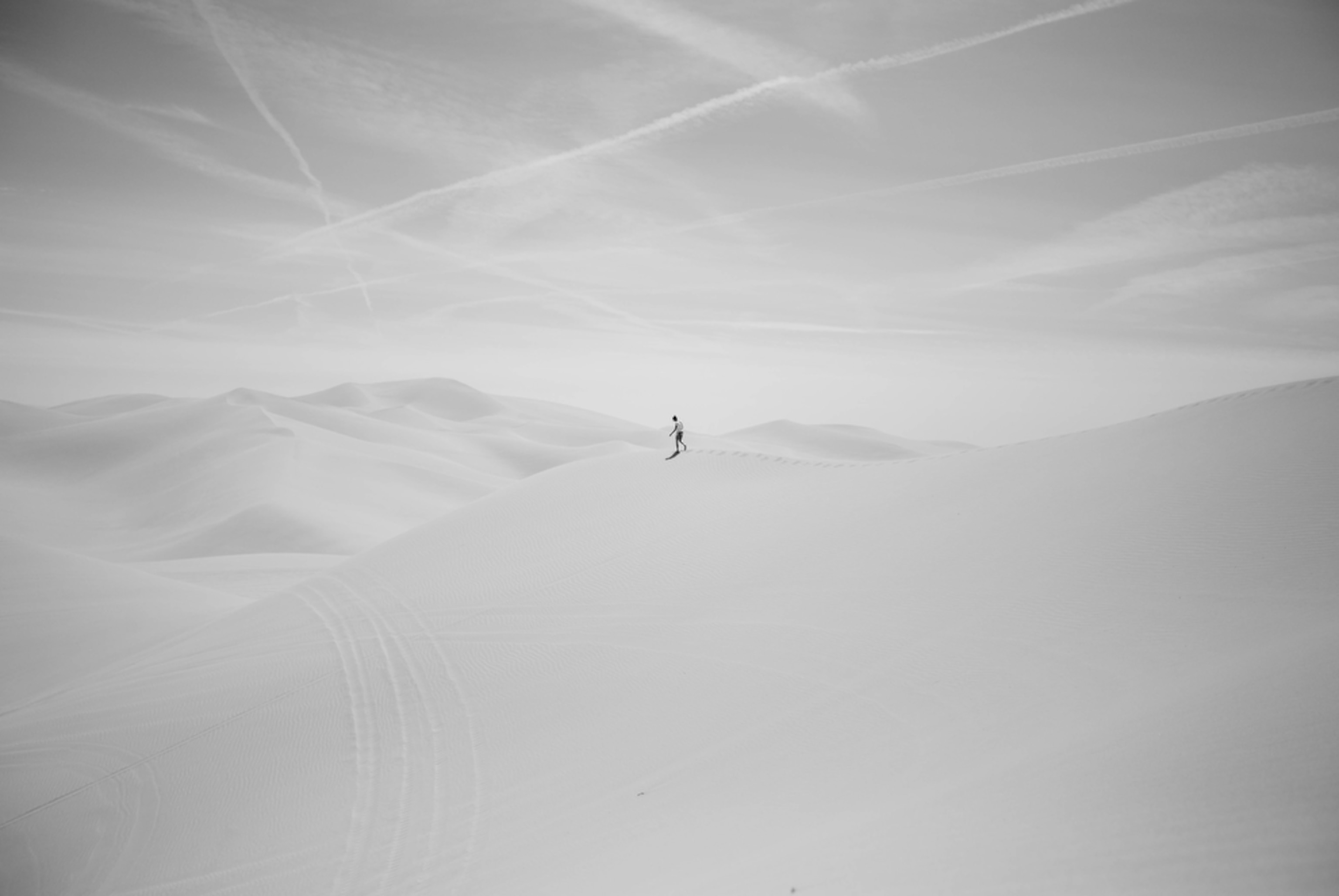 a woman walking in the Imperial Sand Dunes in California
