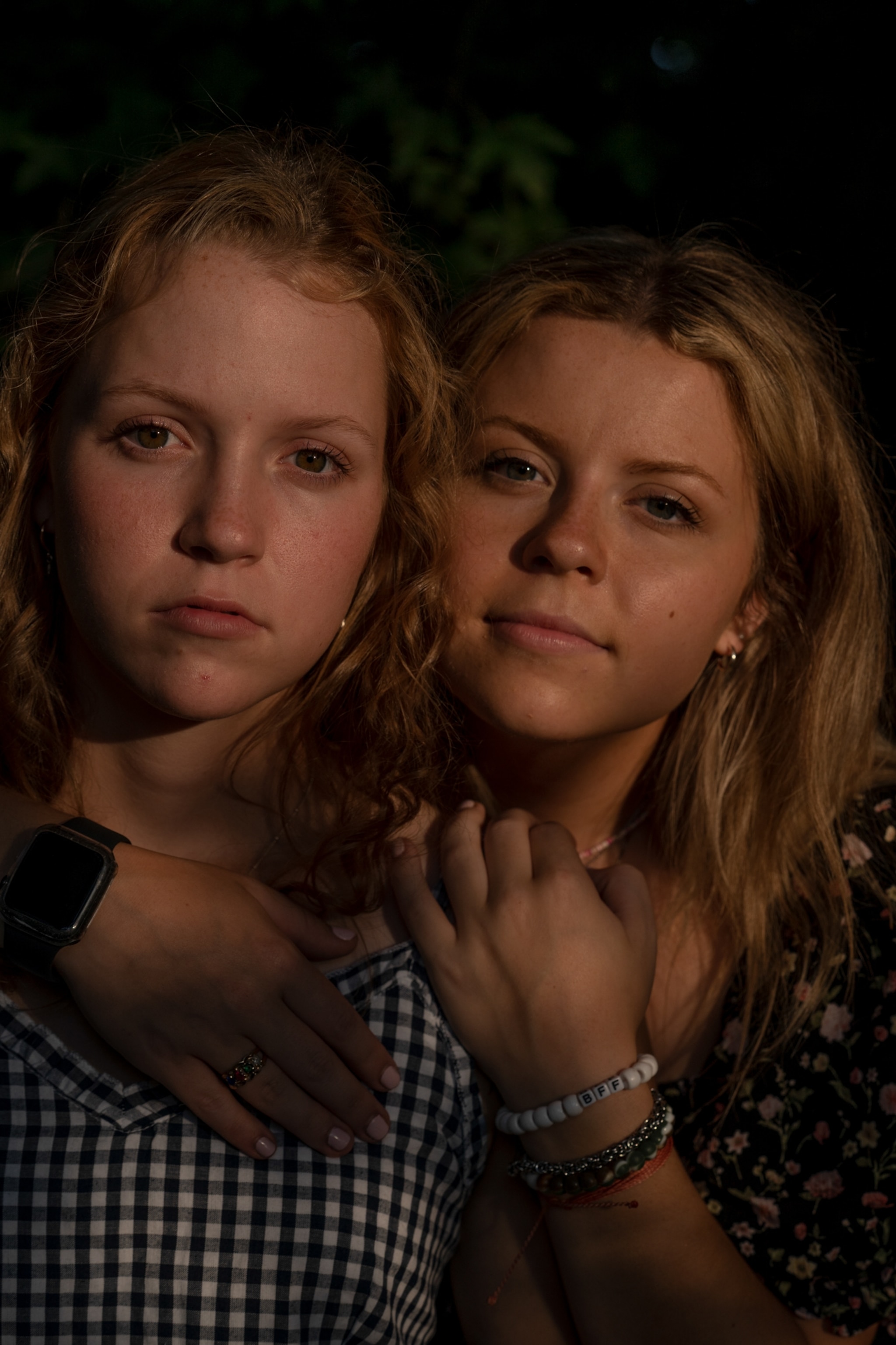 sisters pose for a portrait together