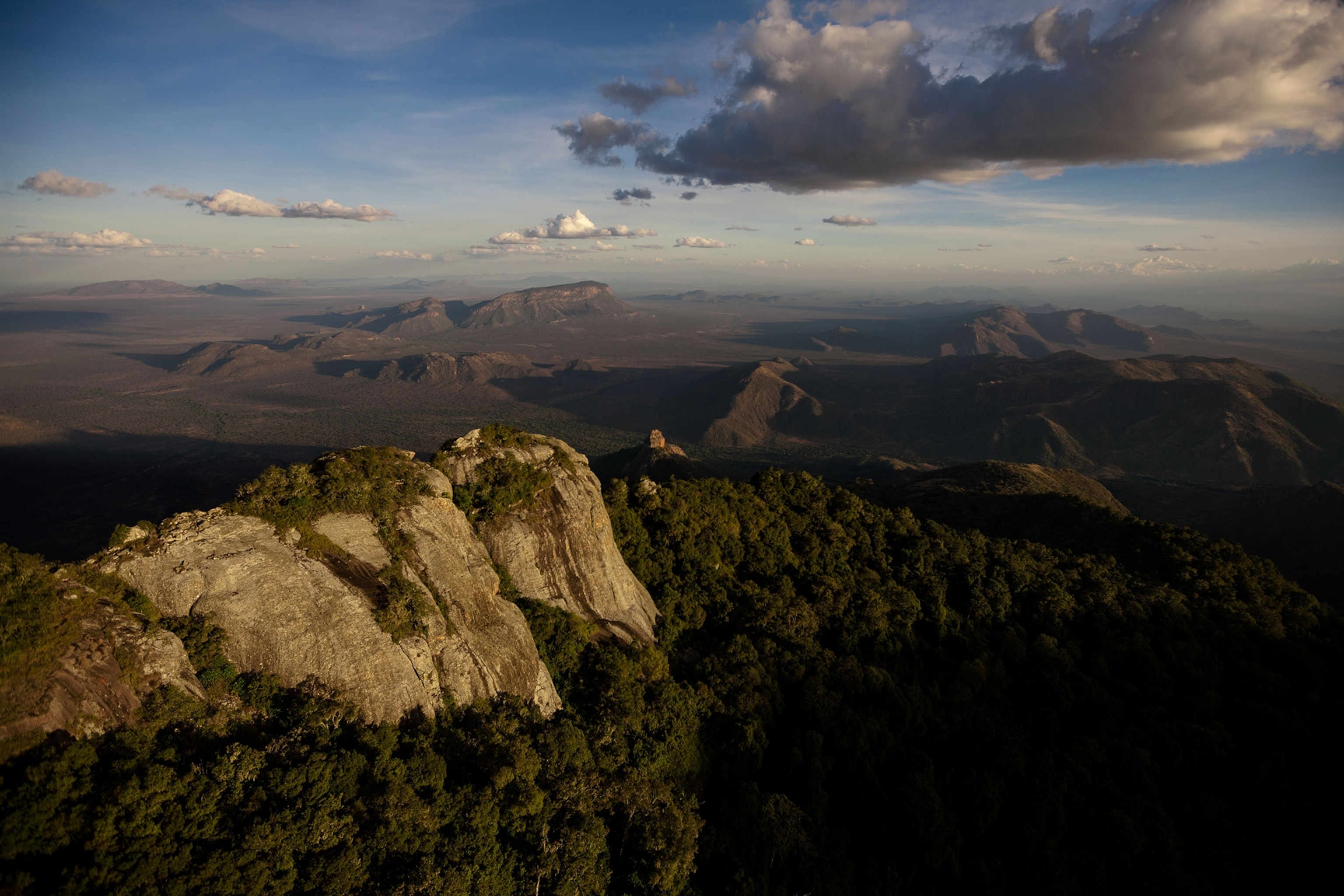 From the Matthews Range, a vista of habitat stretches south toward flat-topped Lolokwe, sacred peak of the Samburu people. Elephant corridors across such terrain are vital to the viability of the population.