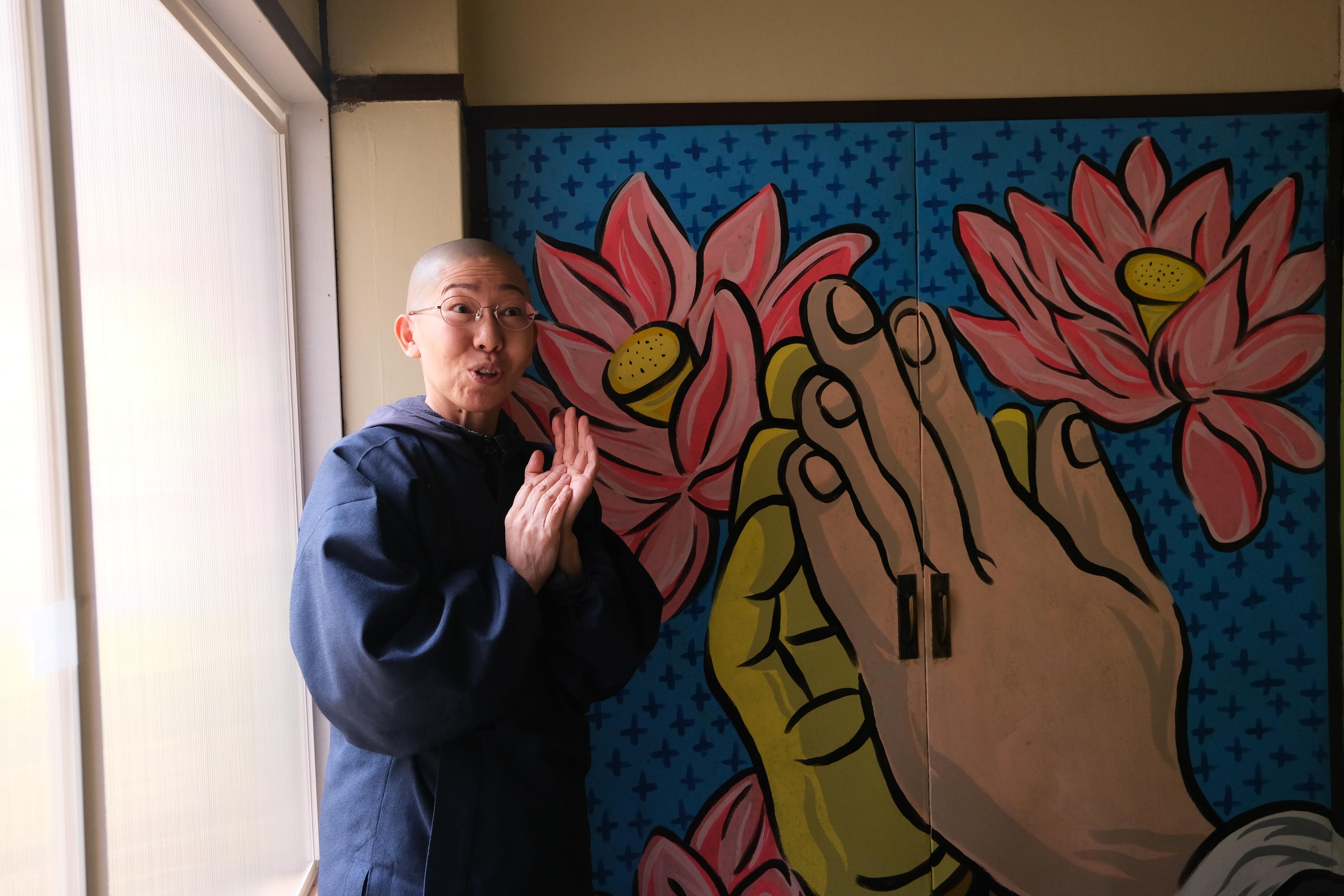 A monk welcomes visitors at the town's temple in Shiraoi. ⁠Photo Camp Japan is an exciting opportunity for students in Hokkaido to engage with National Geographic Explorers to learn photography and writing skills, build connections within their communities and understand the power of story using photography and a slow journalism approach to share the unique stories of their community.