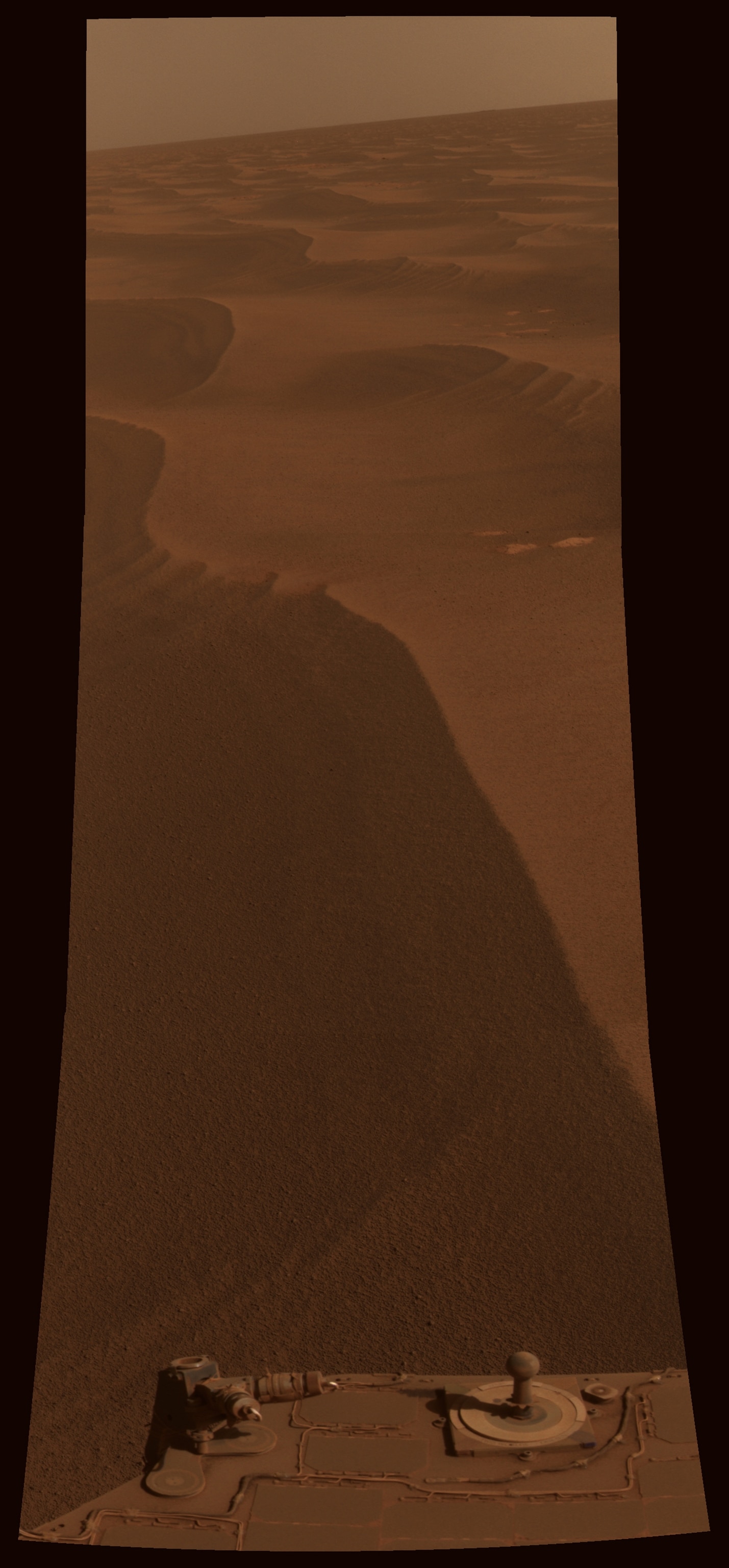 NASA's Mars Exploration Rover Opportunity captured this view of "Burns Cliff" after driving right to the base of this southeastern portion of the inner wall of "Endurance Crater." The view combines frames taken by Opportunity's panoramic camera between the rover's 287th and 294th martian days (Nov. 13 to 20, 2004).