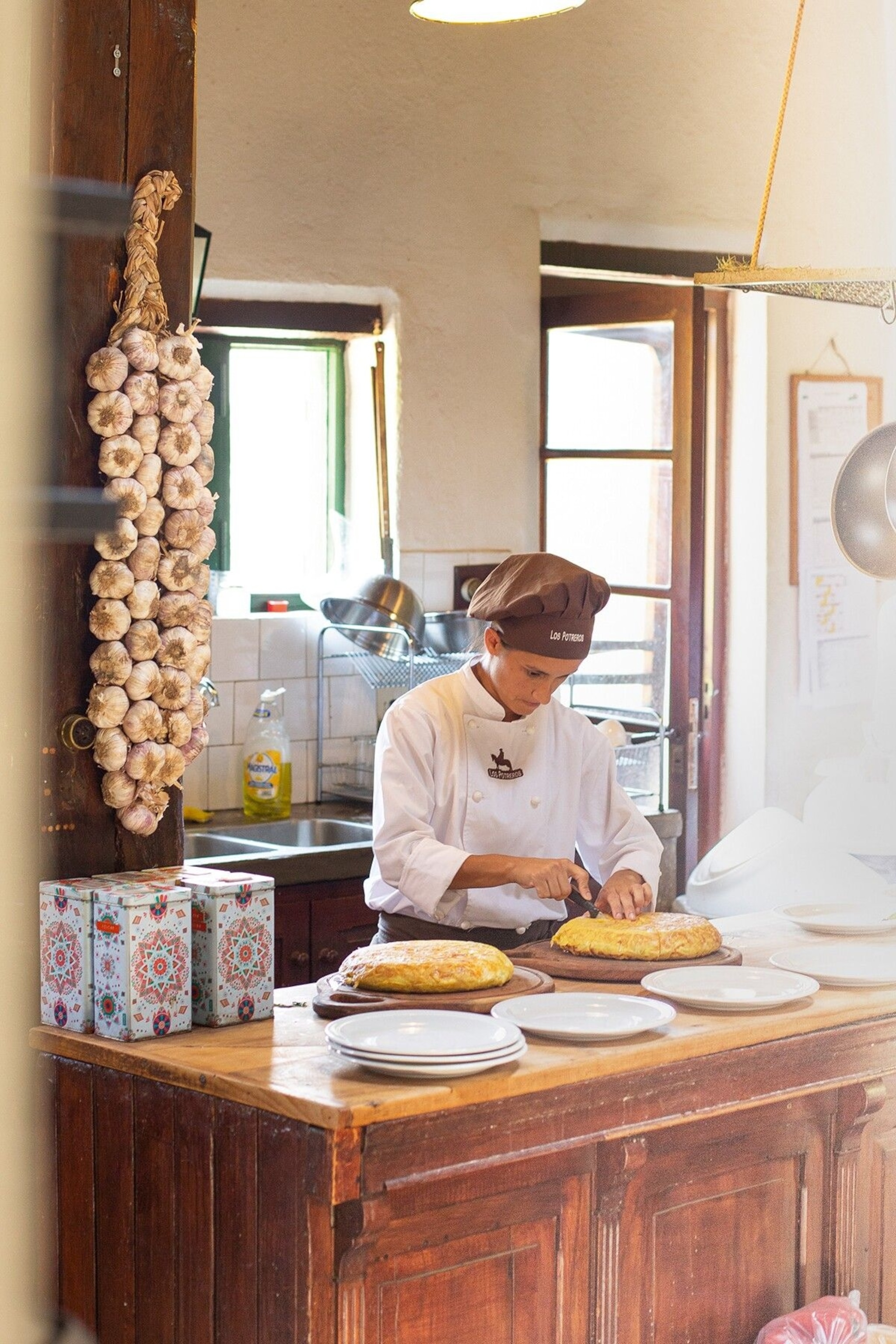 Chef Paula Delgado prepares a tortilla de papas, or Spanish omelette, made with potatoes and onions, using a recipe from Argentine culinary legend Doña Petrona.