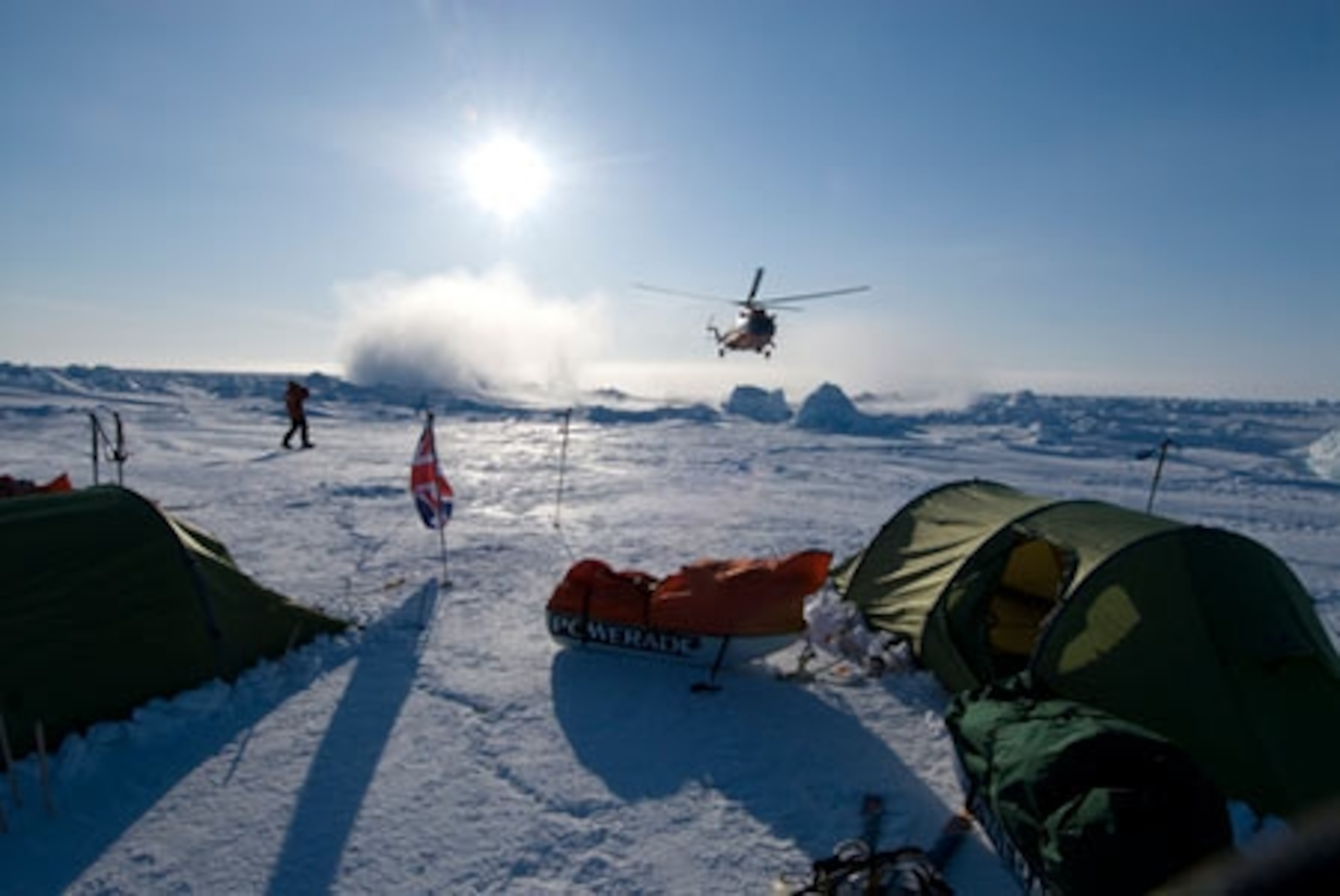 Helicopter approaches Camp Barneo near the North Pole. National Geographic stock photo.