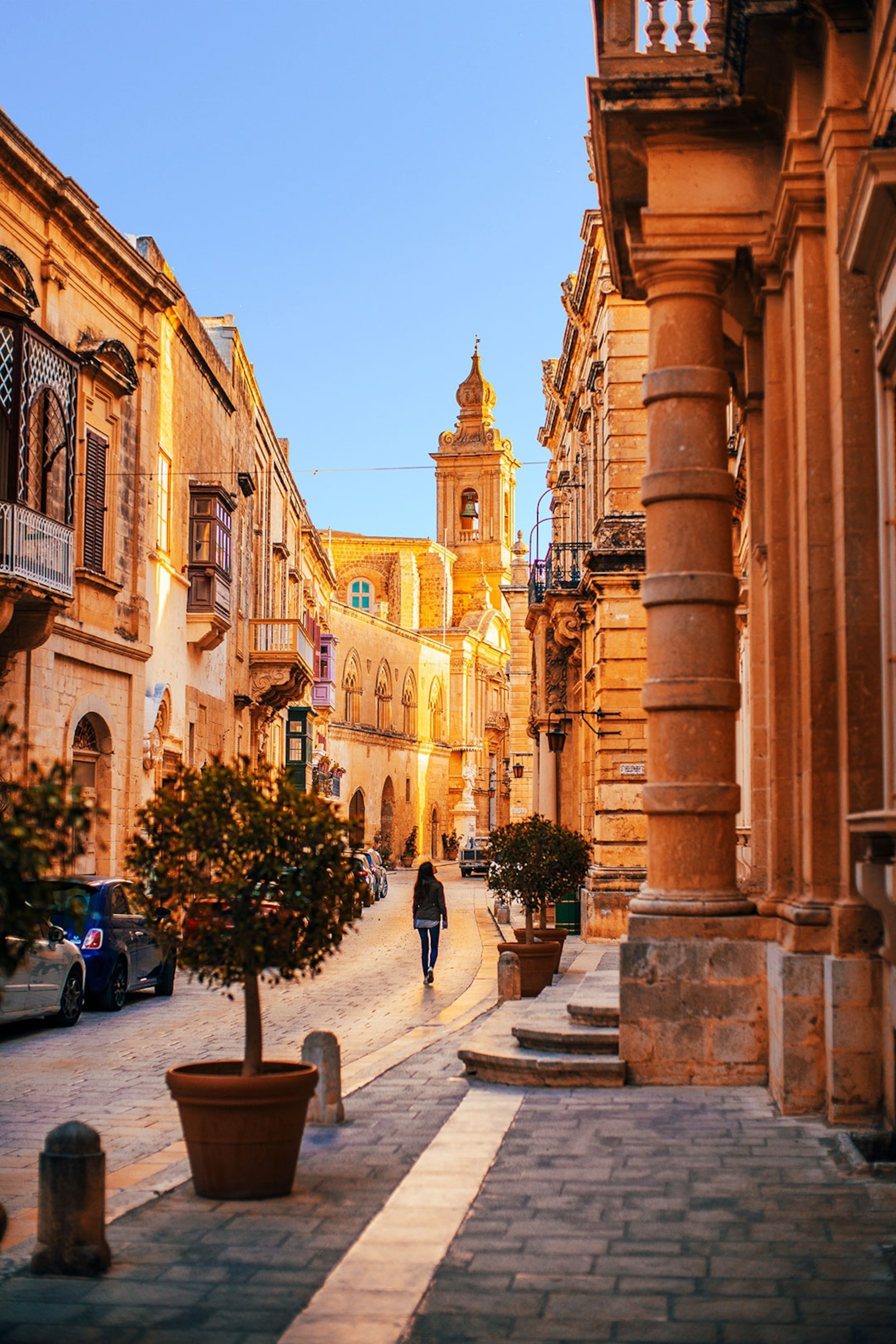 A woman walking in Mdina, Malta.