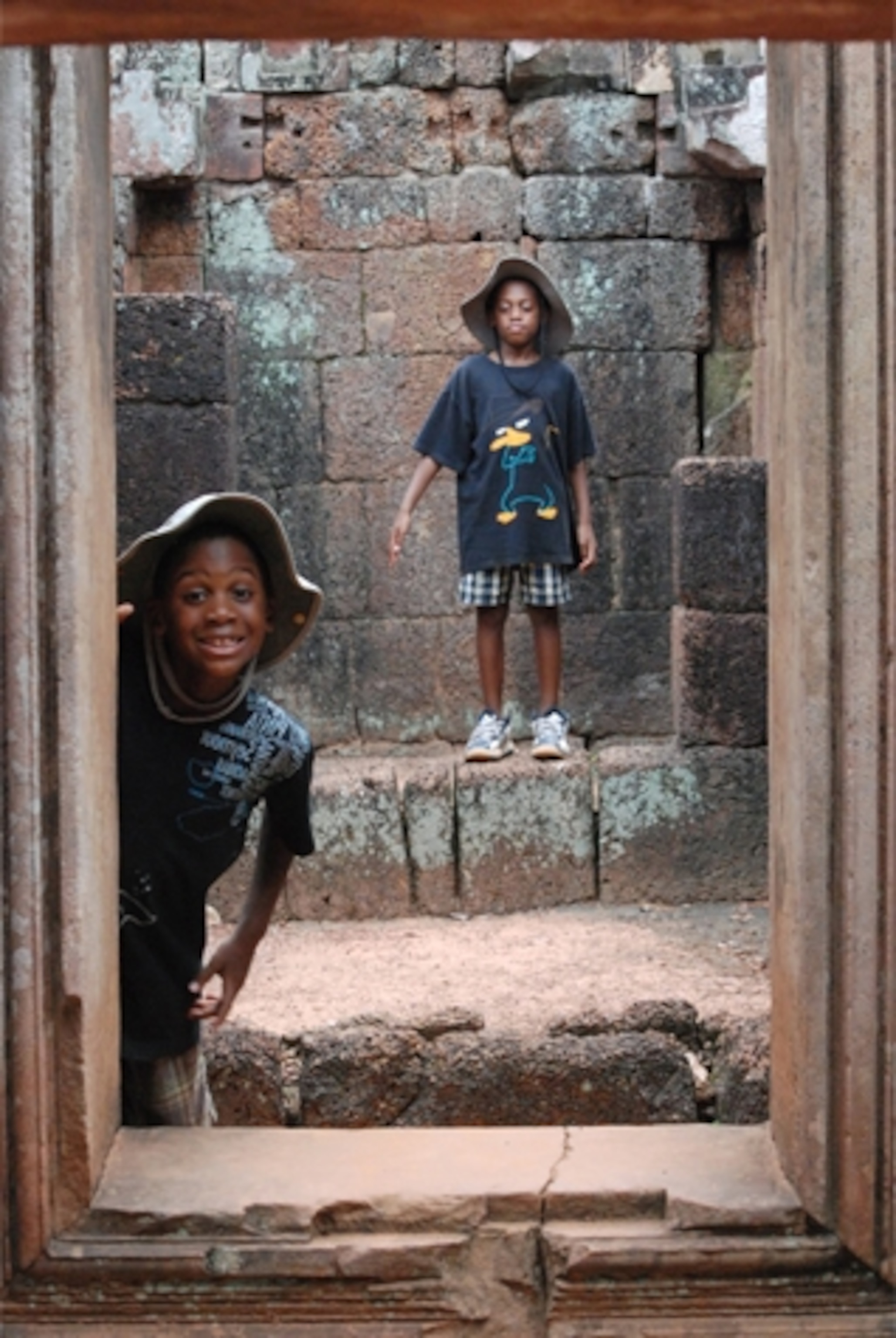 The Davis kids clowning around in Angkor Thom. (Photograph by Heather Davis)