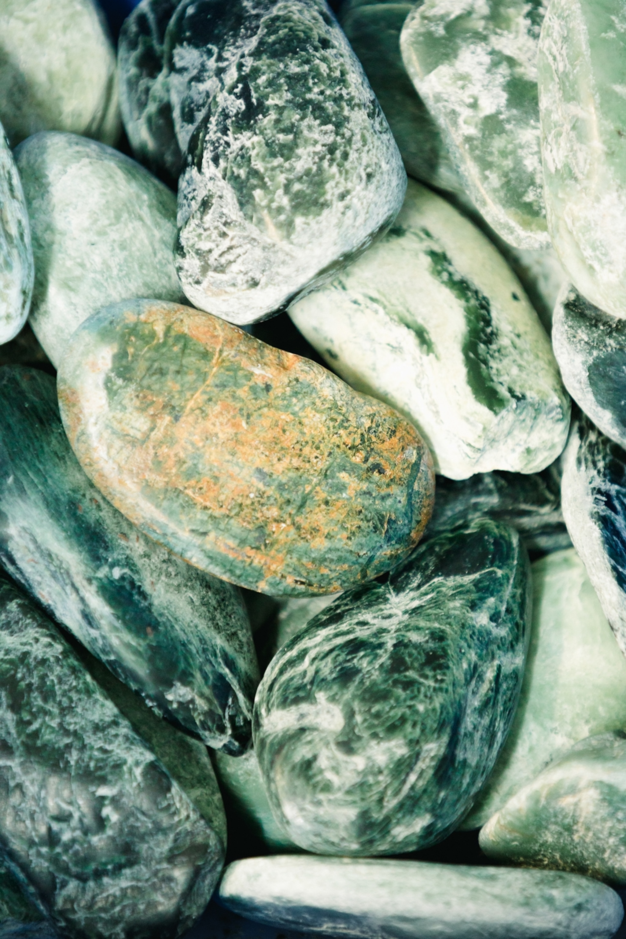 A selection of polished and smooth, pebble-stoned jade.