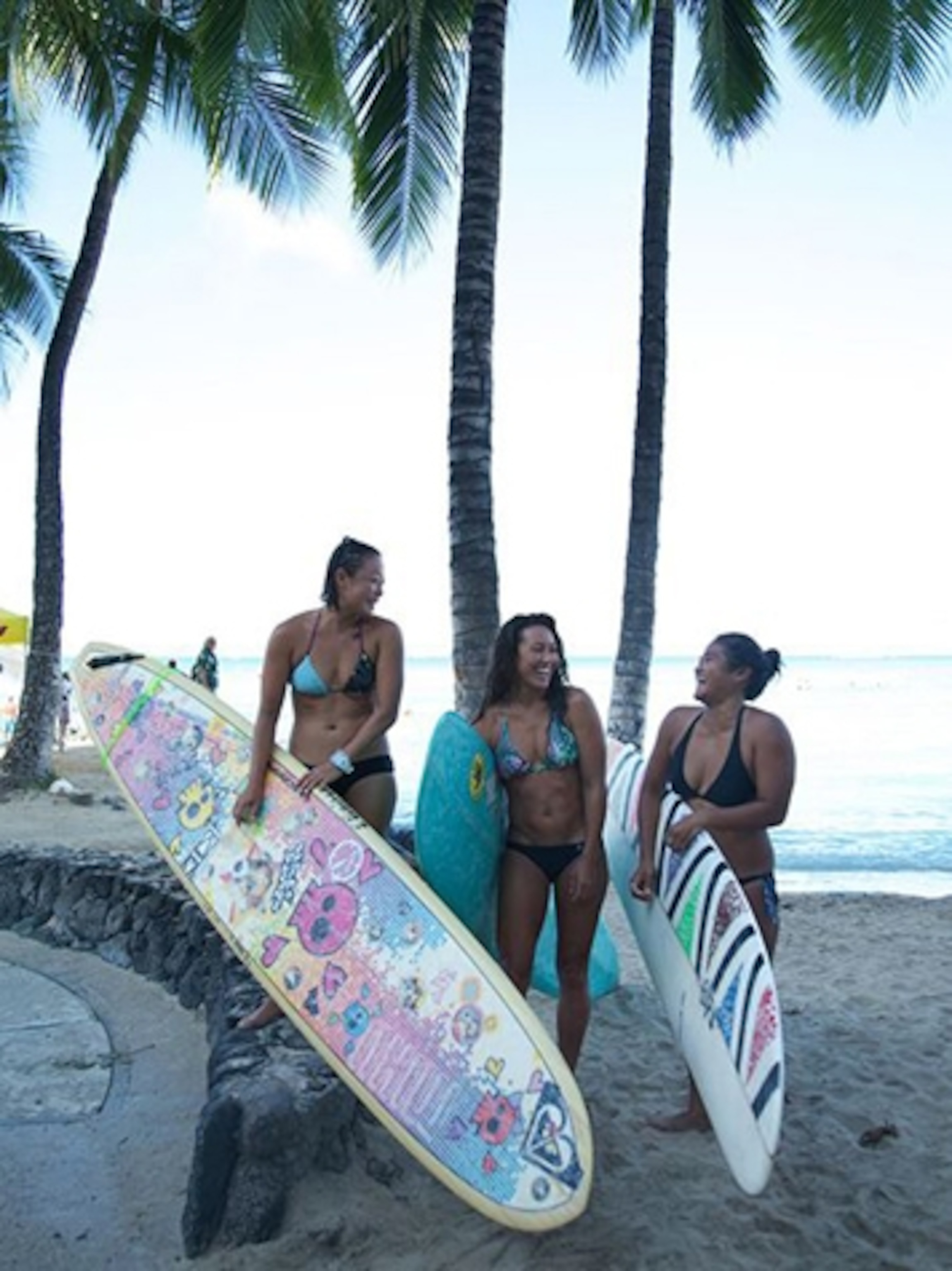 Longboard surfers on the beach in Honolulu (Photograph by Susan Seubert)