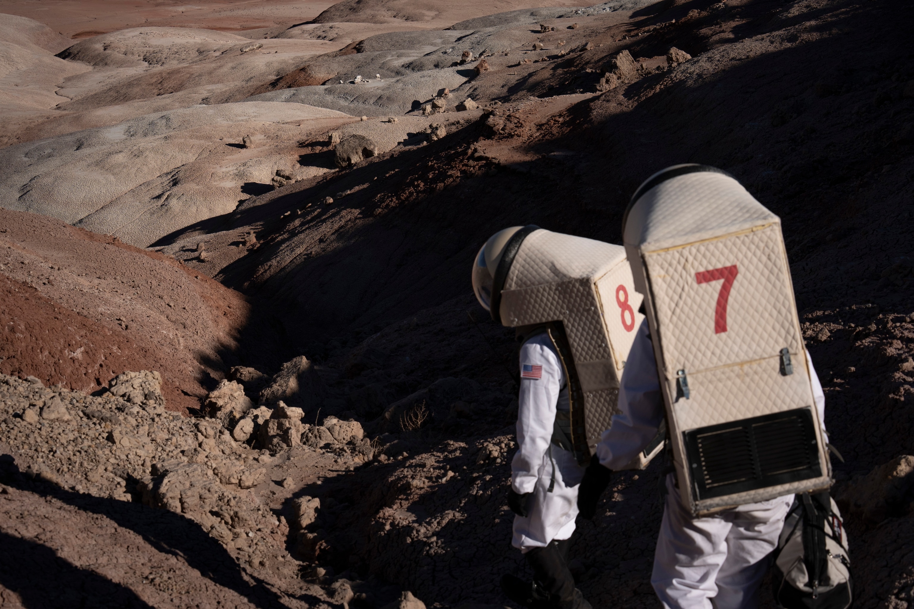 Commander Rym Chaïd and Crew Engineer Ricardo J. Gonzalez during an EVA to study emergency medical responses on Sol 9 at Mars Desert Research Station outside of Hanksville, Utah on October 21, 2025.