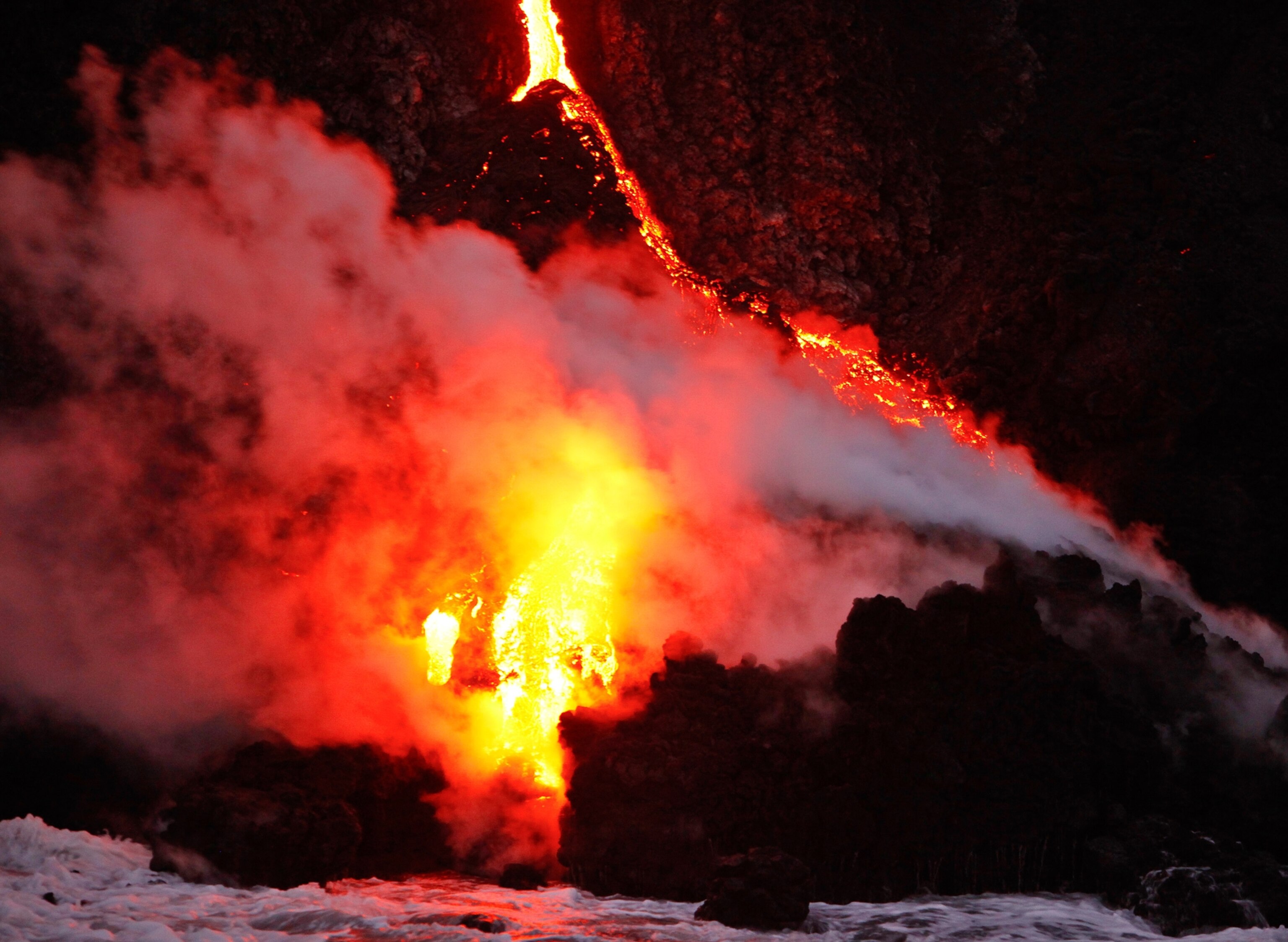 Volcano eruption pictures -- lava flowing into ocean