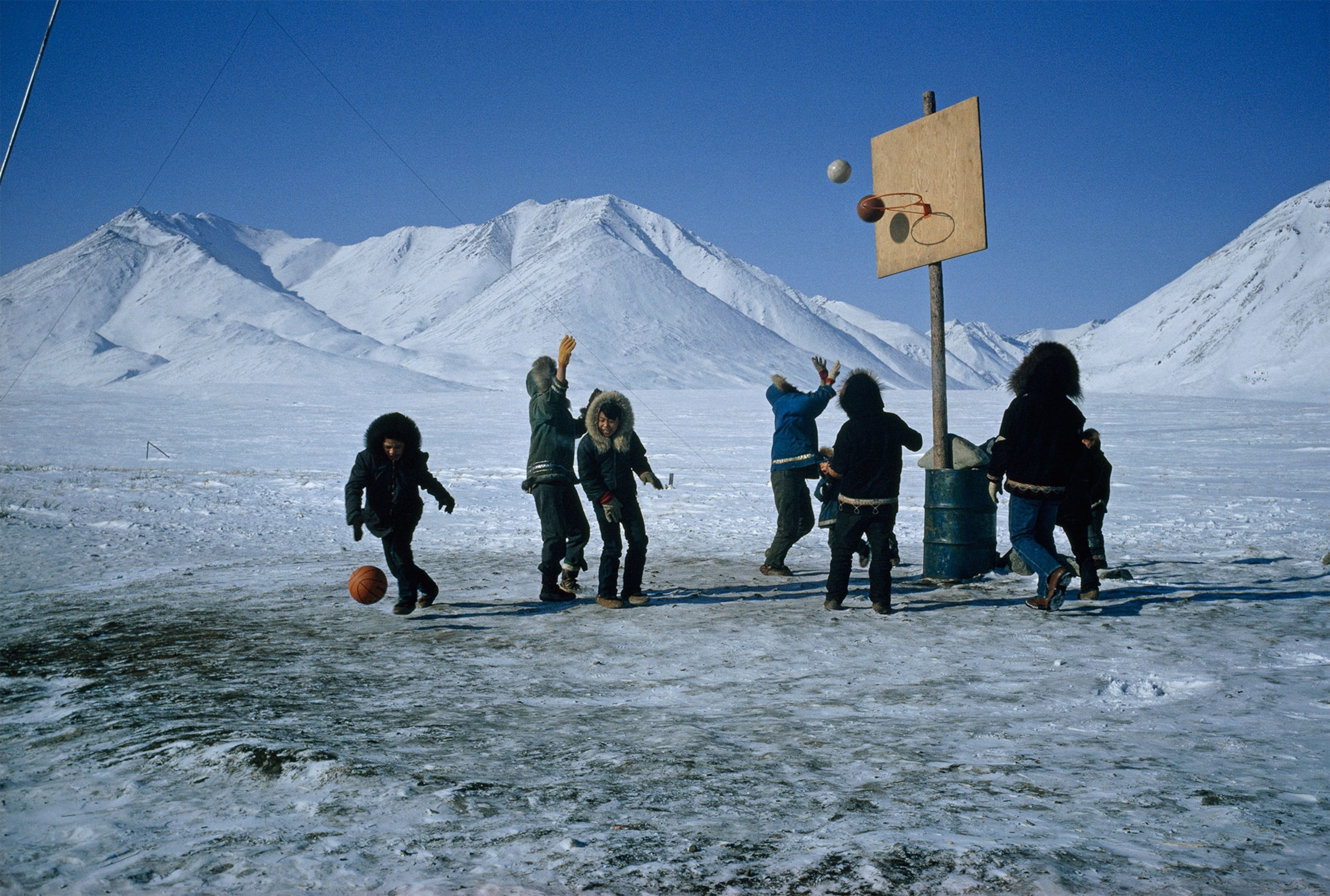 Alaska Natives playing basketball on ice