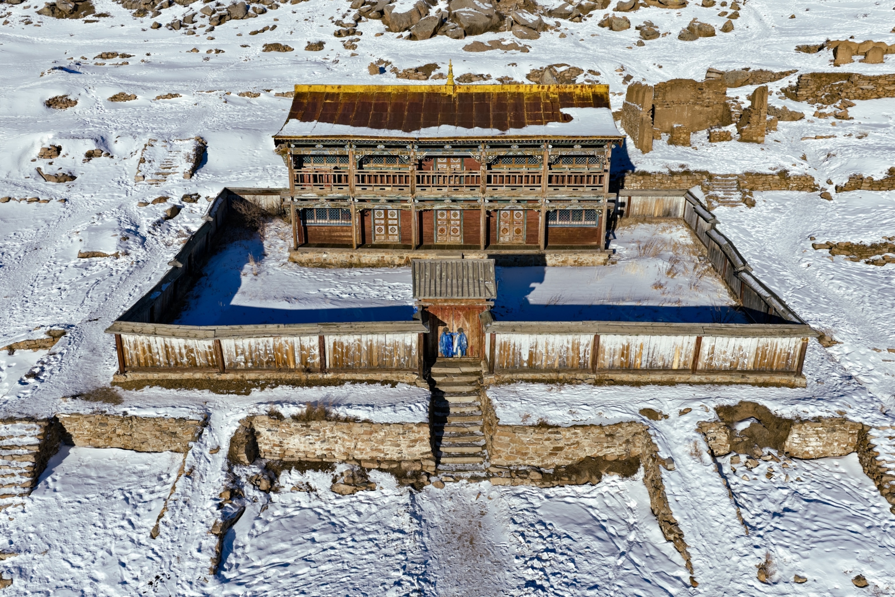 A building surrounded by snow.