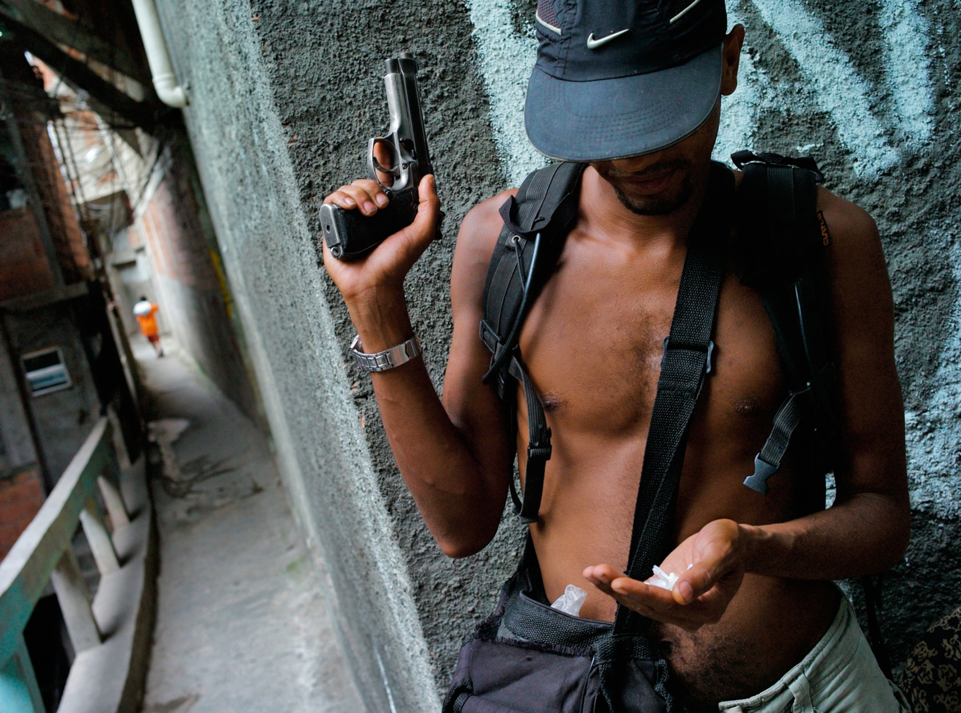 a drug dealer holding bags of cocaine