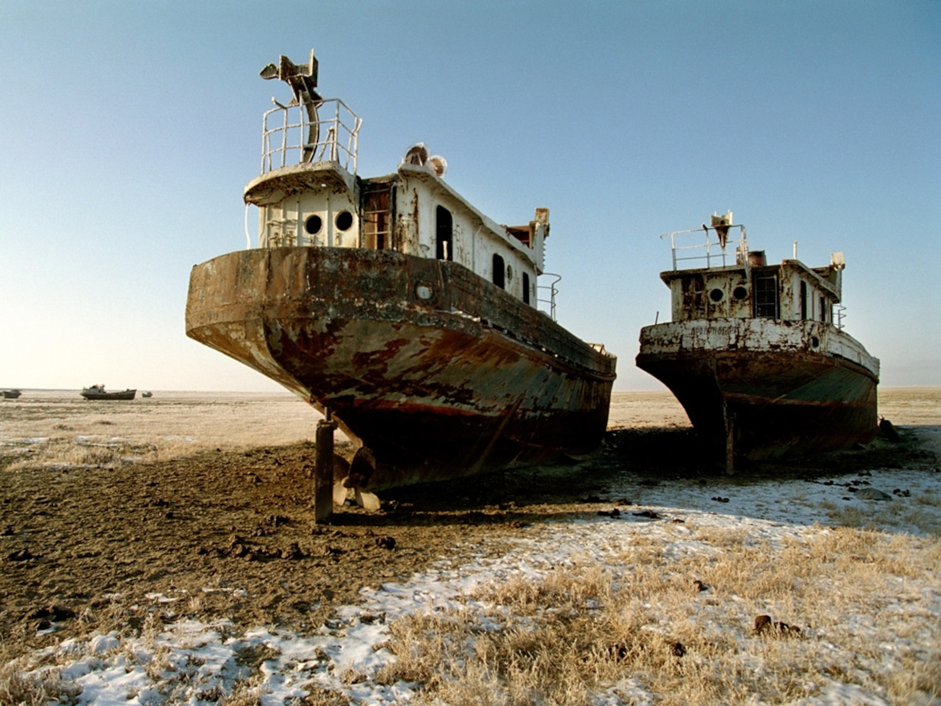 Old fishing boats on a dry landscape