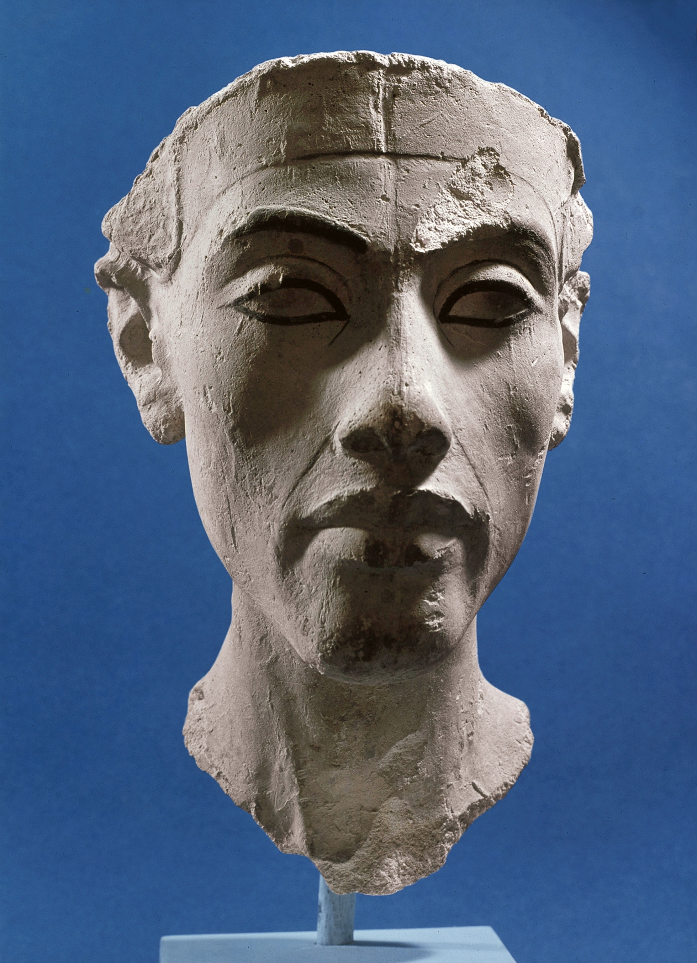 Akhenaten's face stares out from a plaster bust found in Amarna, dated circa 1353-1336 B.C.