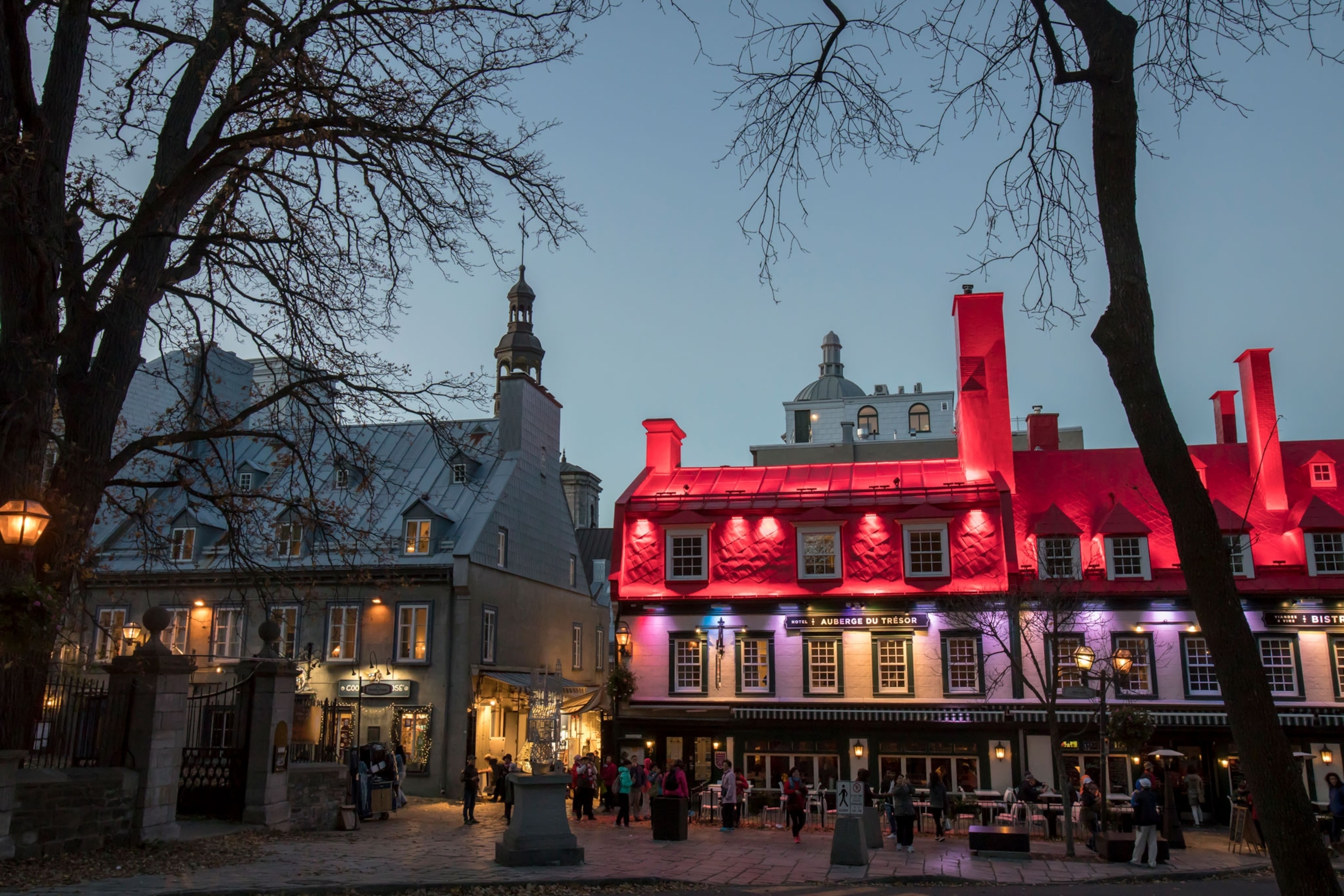 tourists outside hotels and cafes in old town Quebec City, Canada